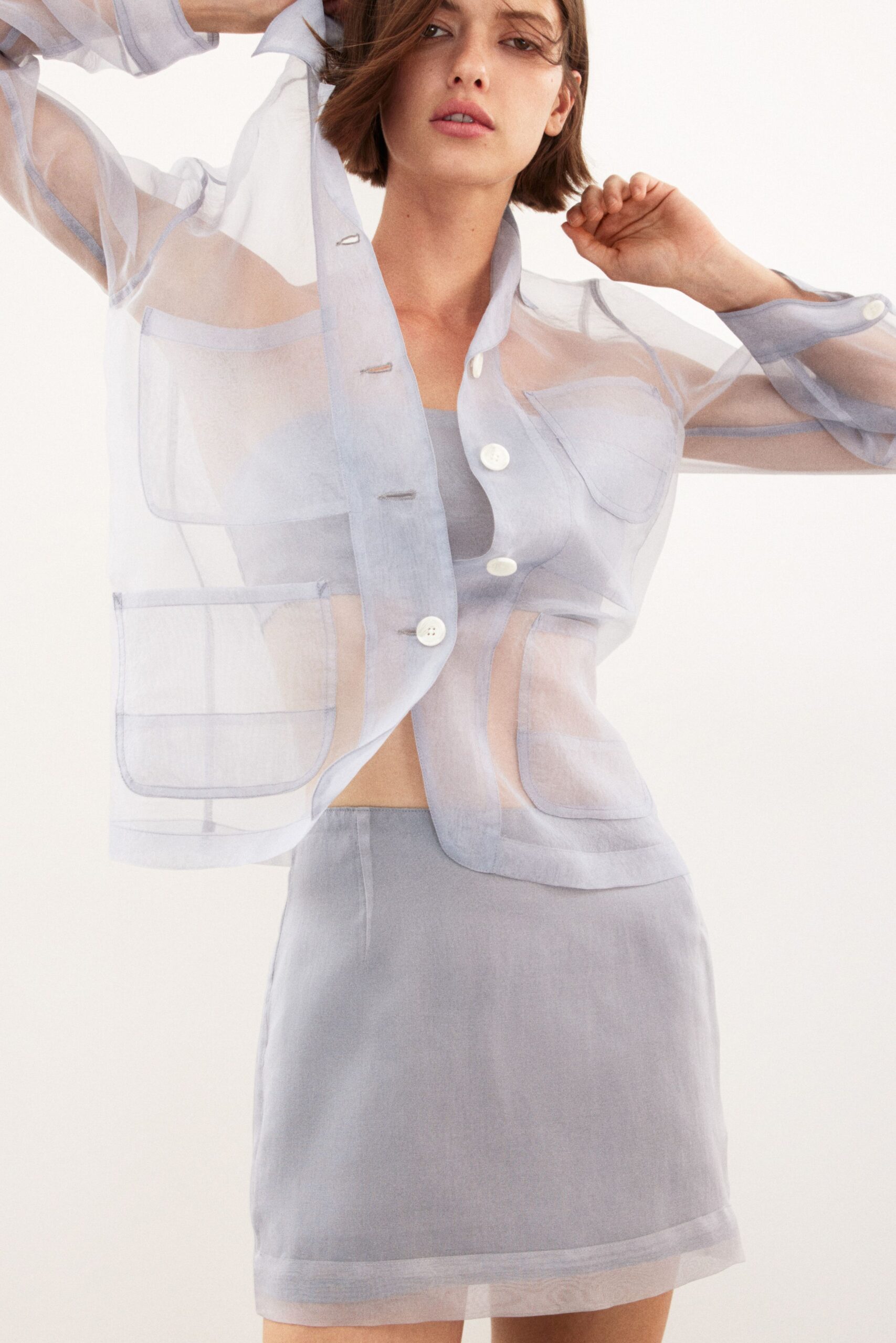blue cotton long-sleeve collared fitted buttoned sheer jacket