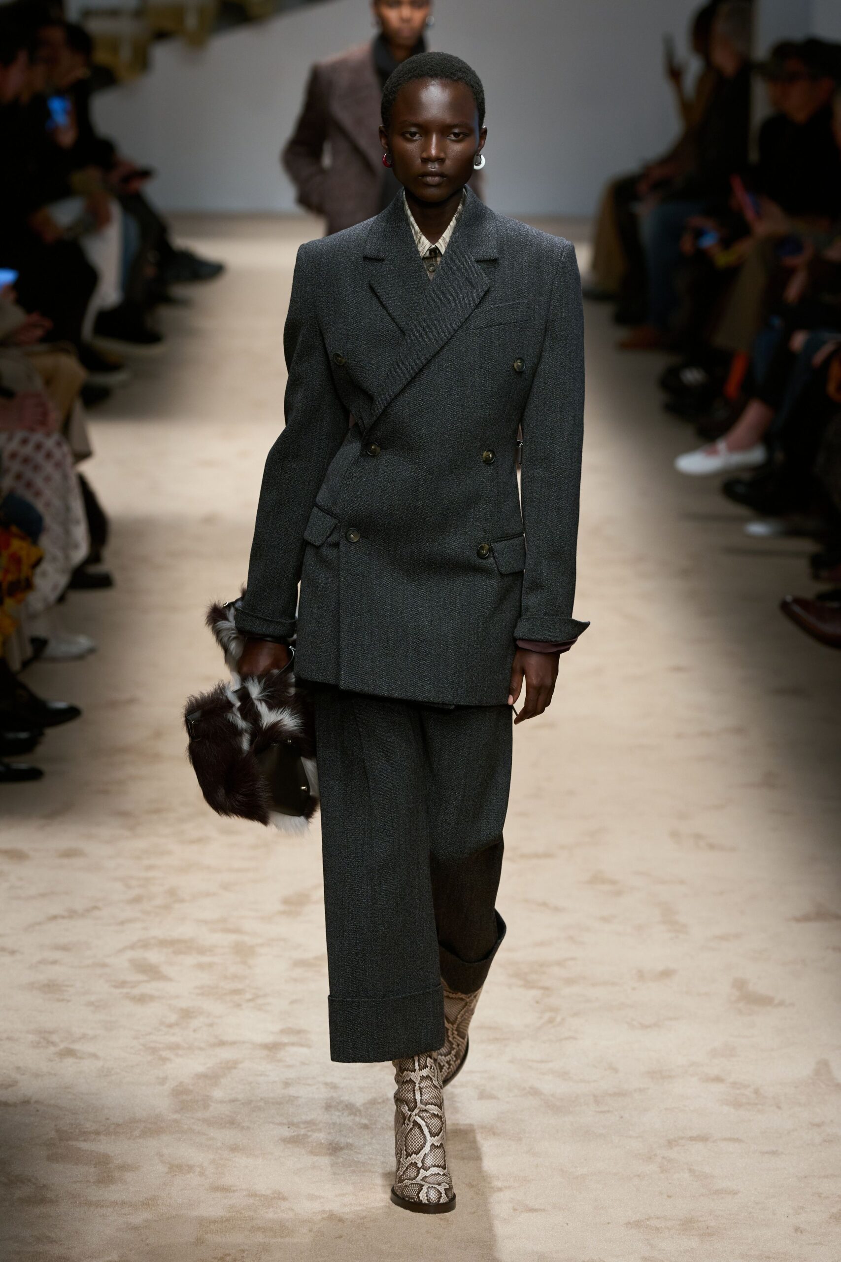 gray tailored suit with snakeskin shoes