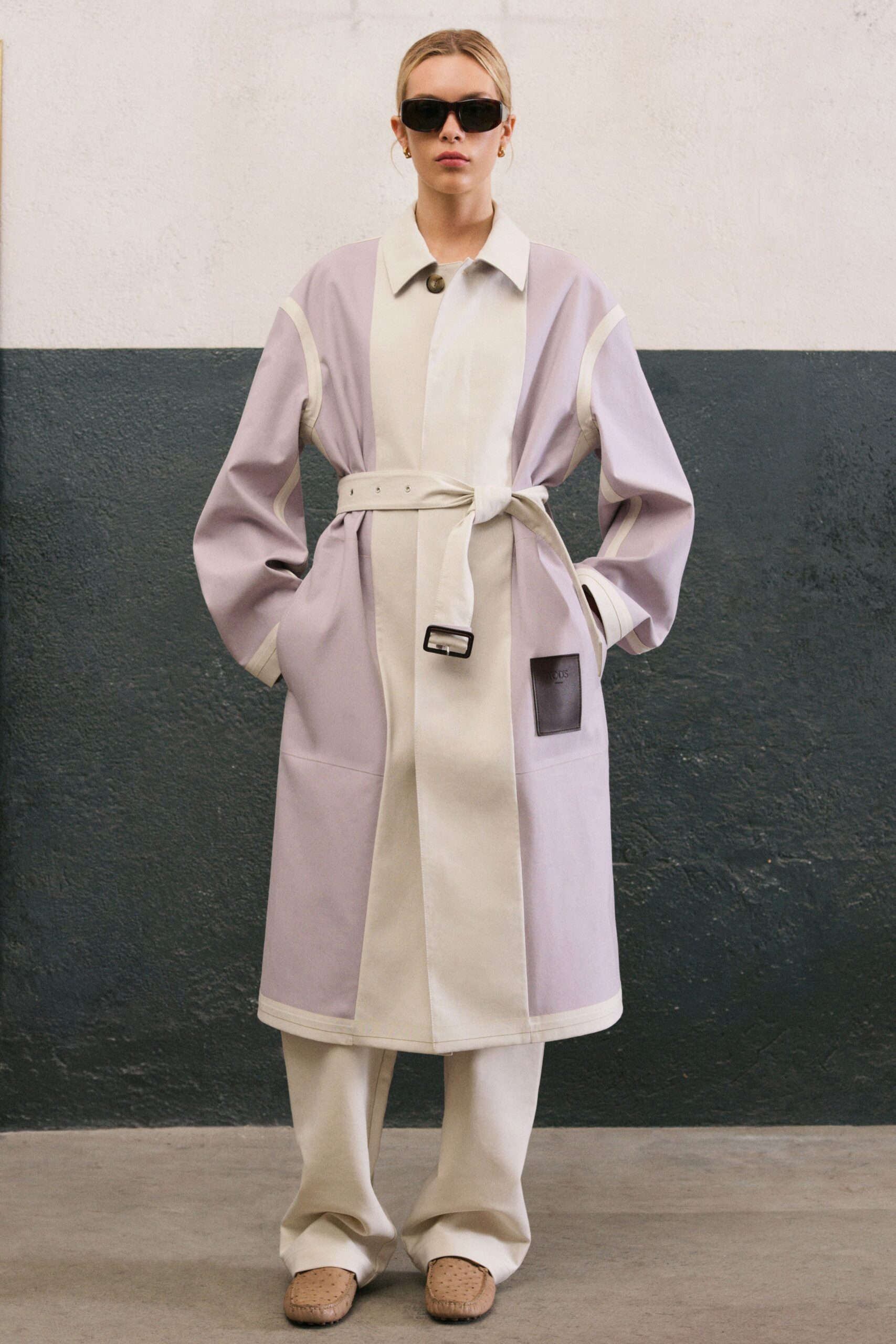 lavender and white coat with beige pants