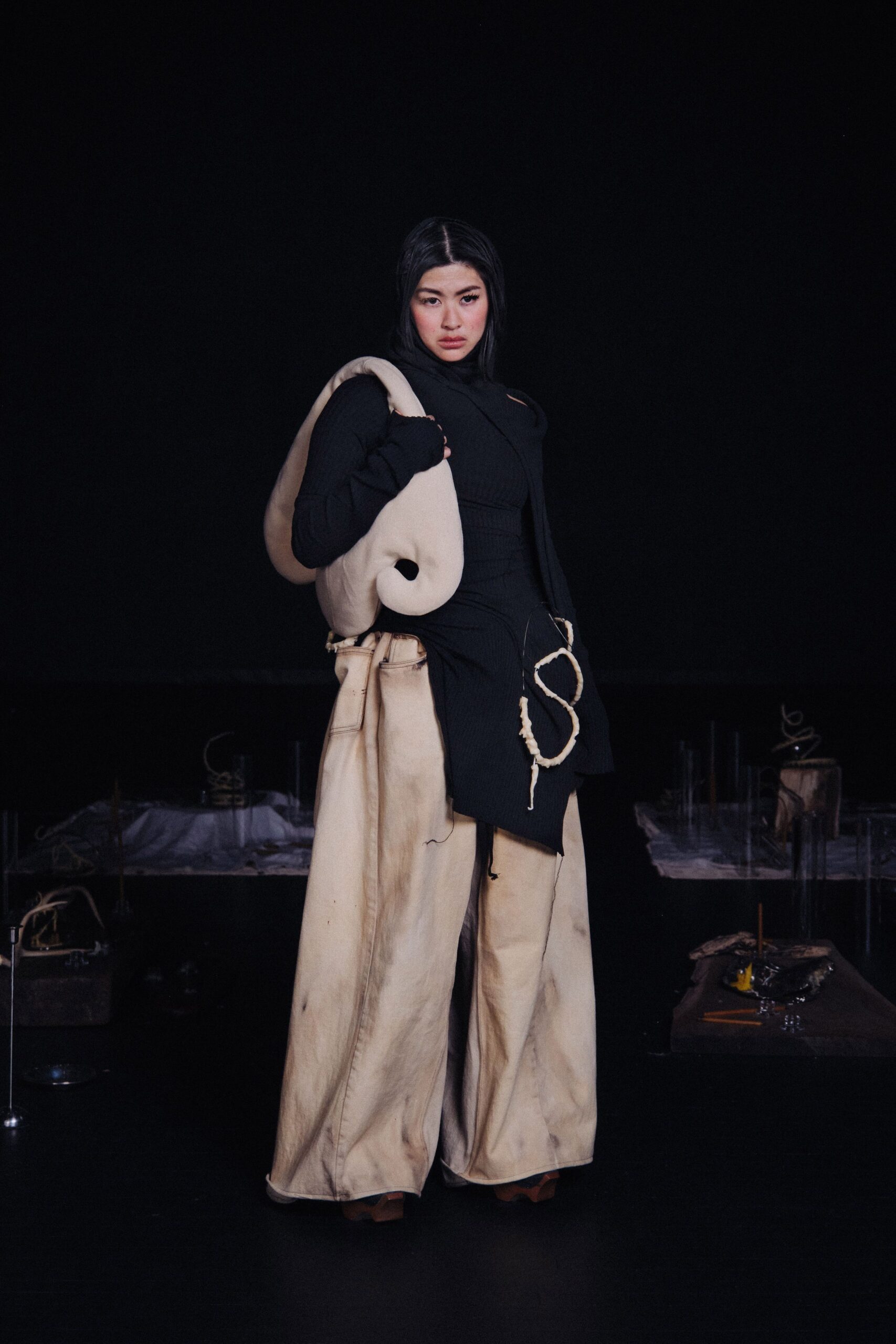 black fitted top with beige wide-leg pants