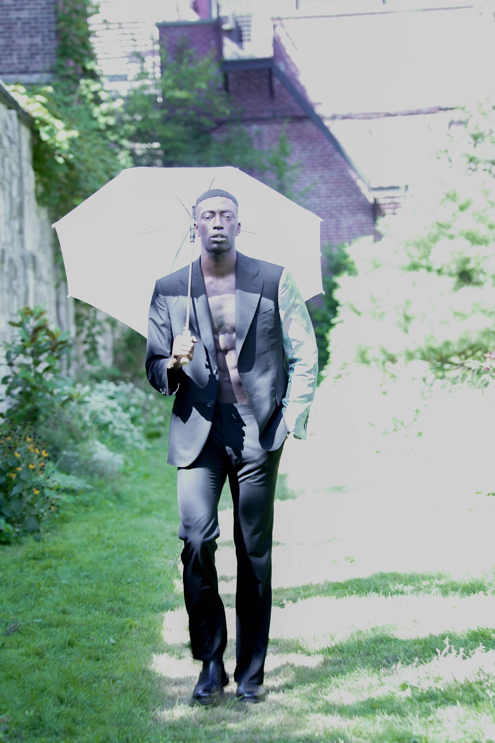 black tailored suit with umbrella