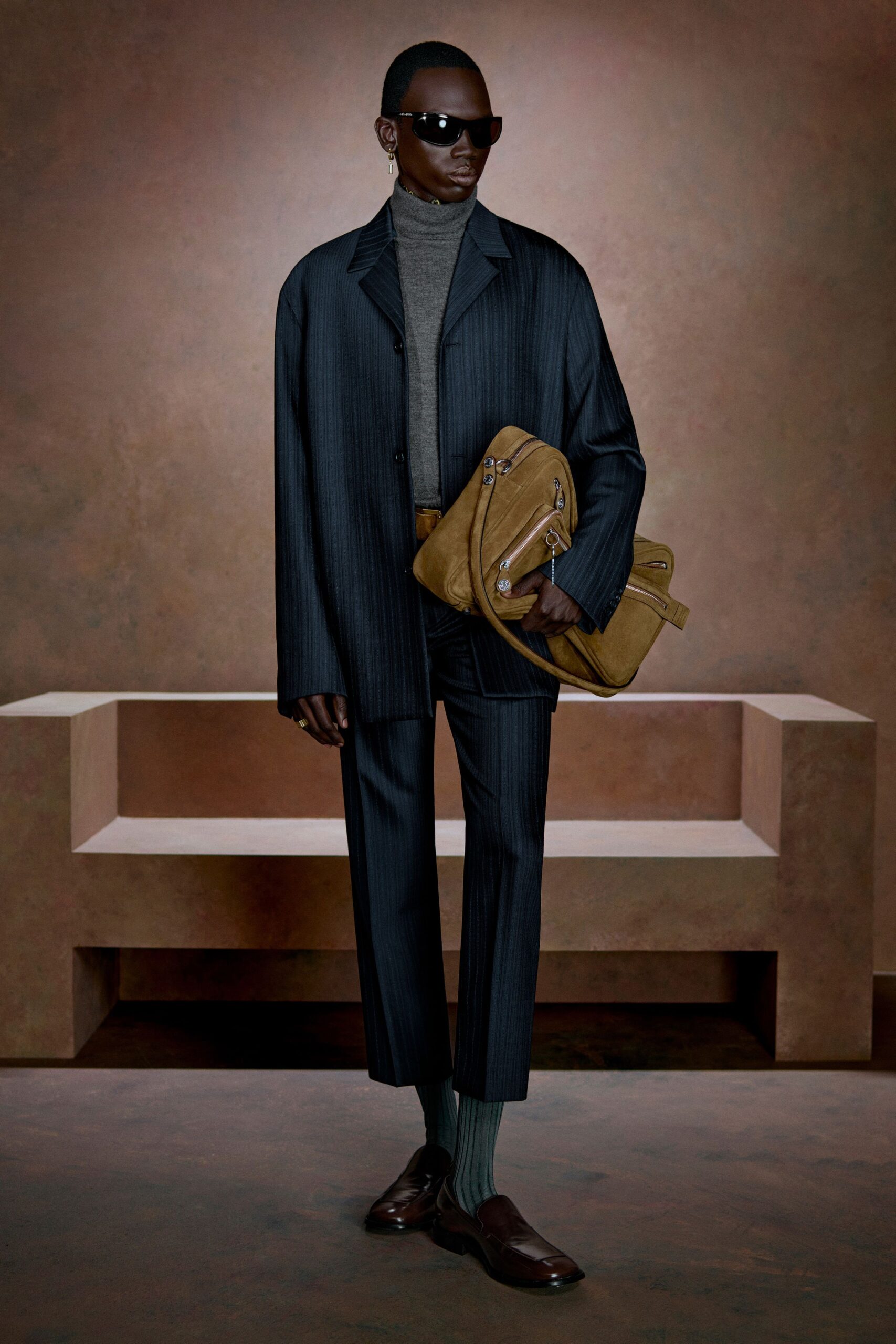 tailored black suit with gray turtleneck