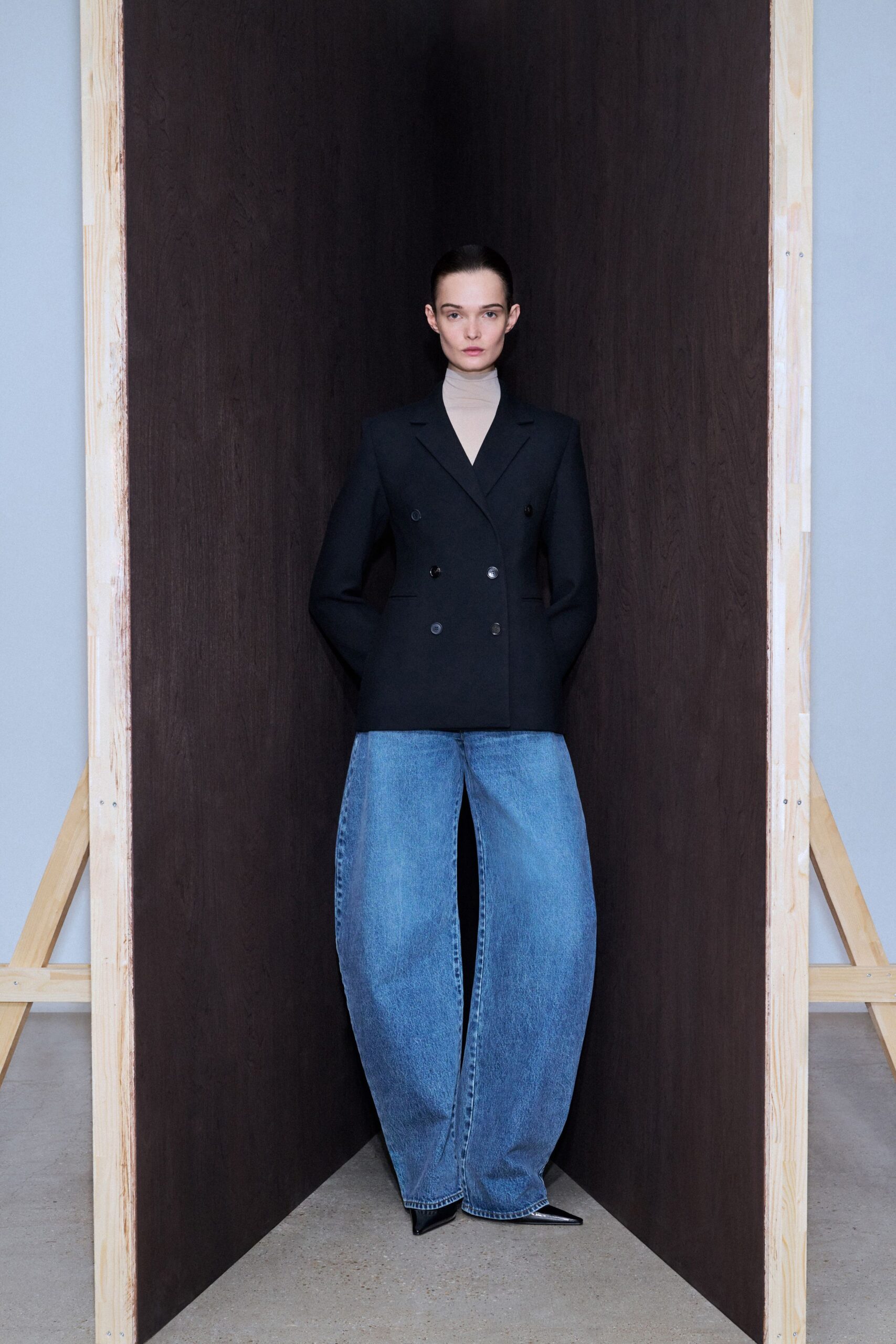 black tailored blazer and blue wide-leg pants