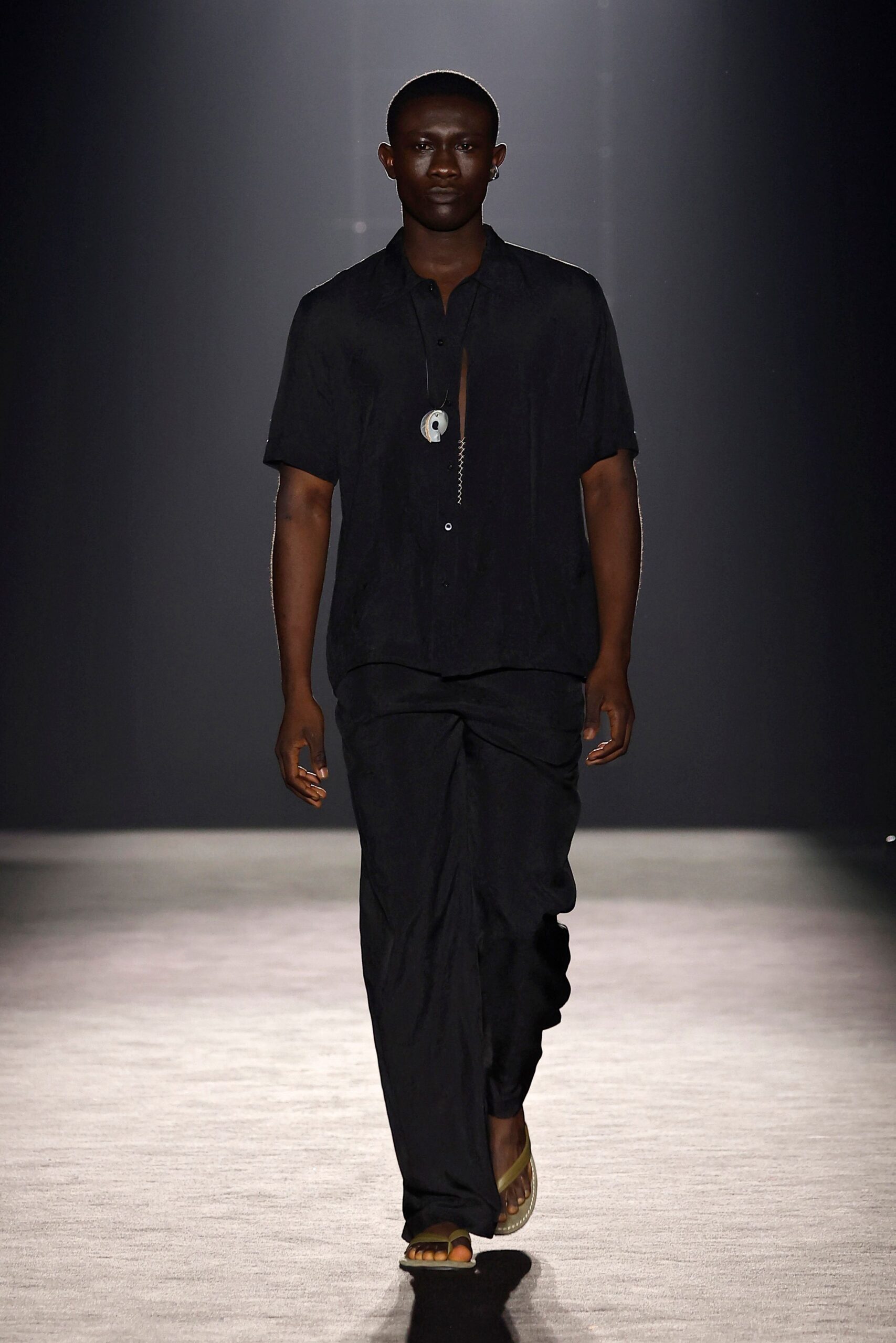 black relaxed shirt and pants with sandals