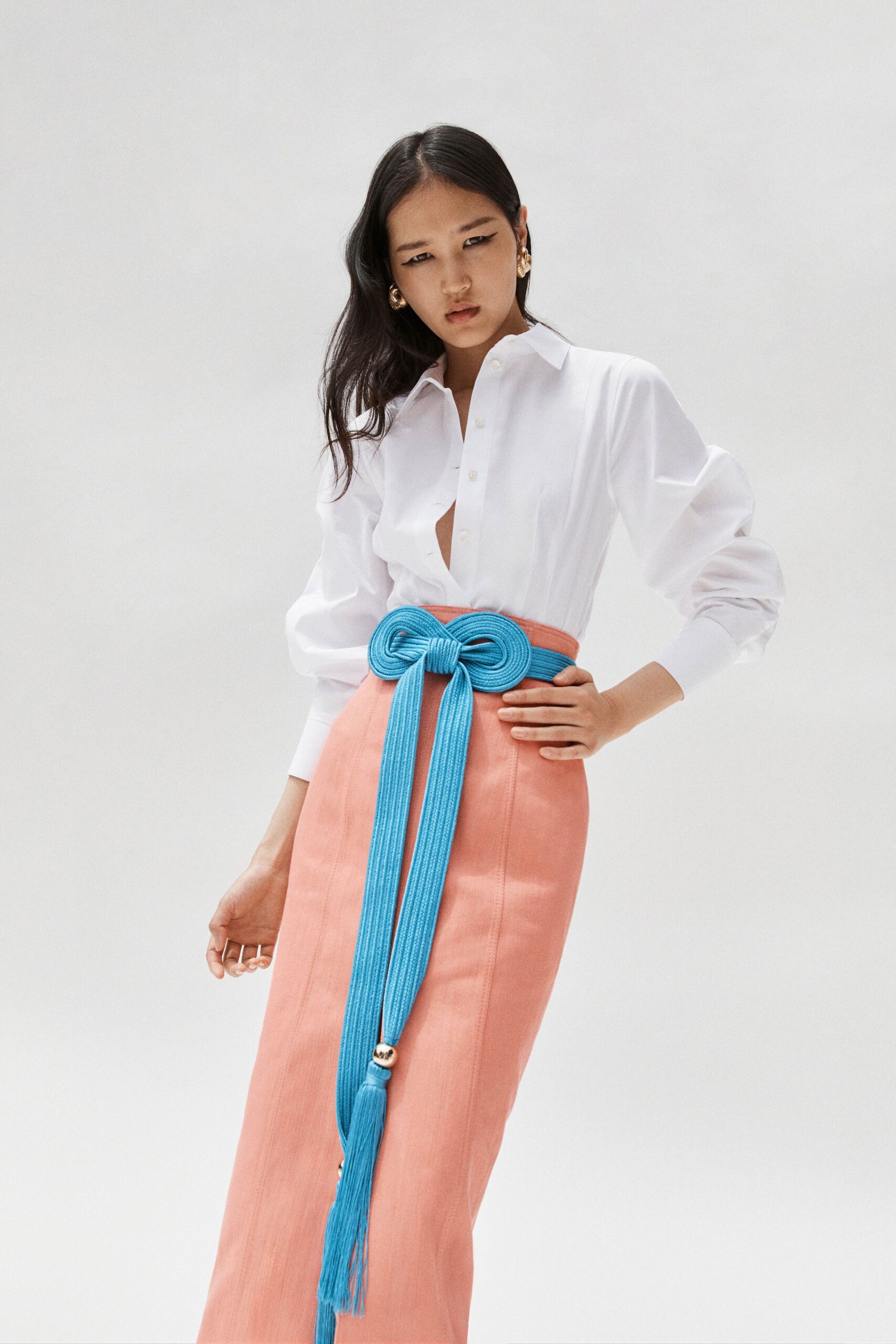 white shirt pink skirt blue belt