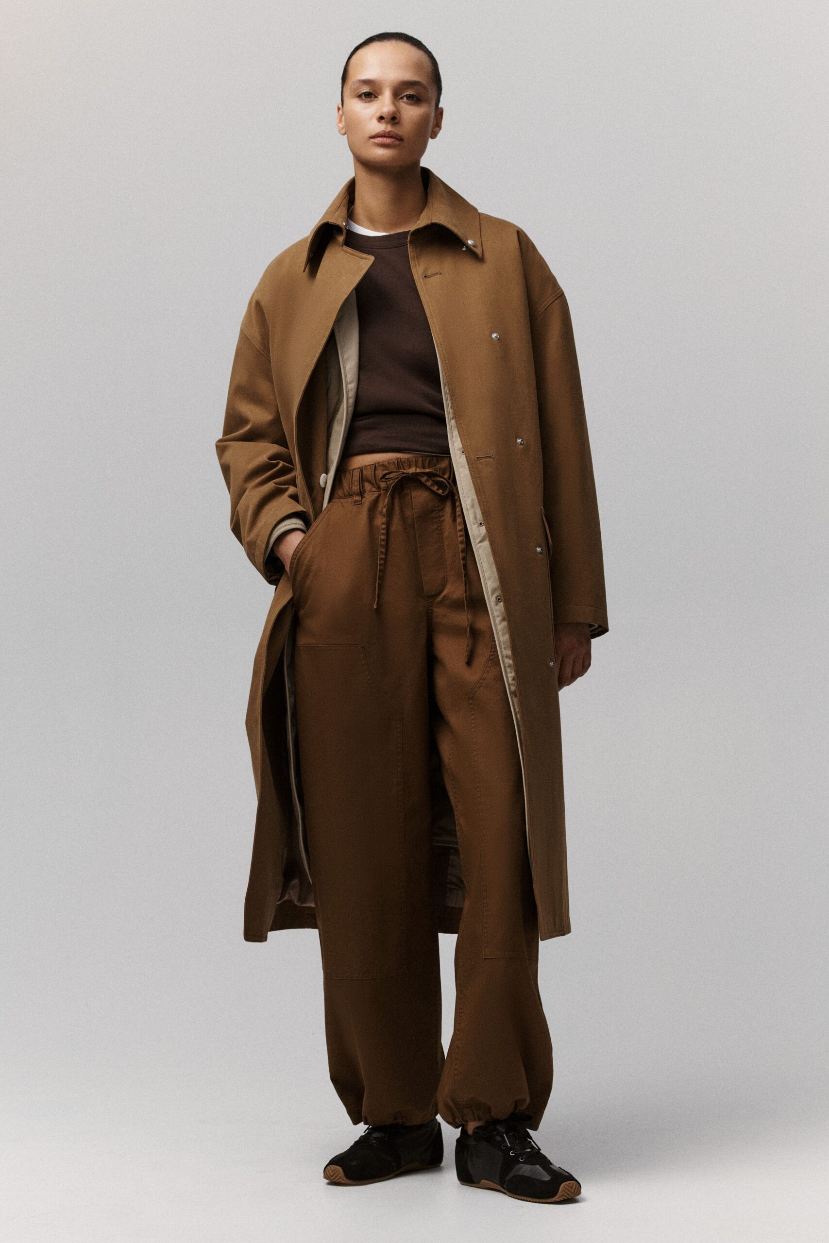 brown coat with relaxed pants