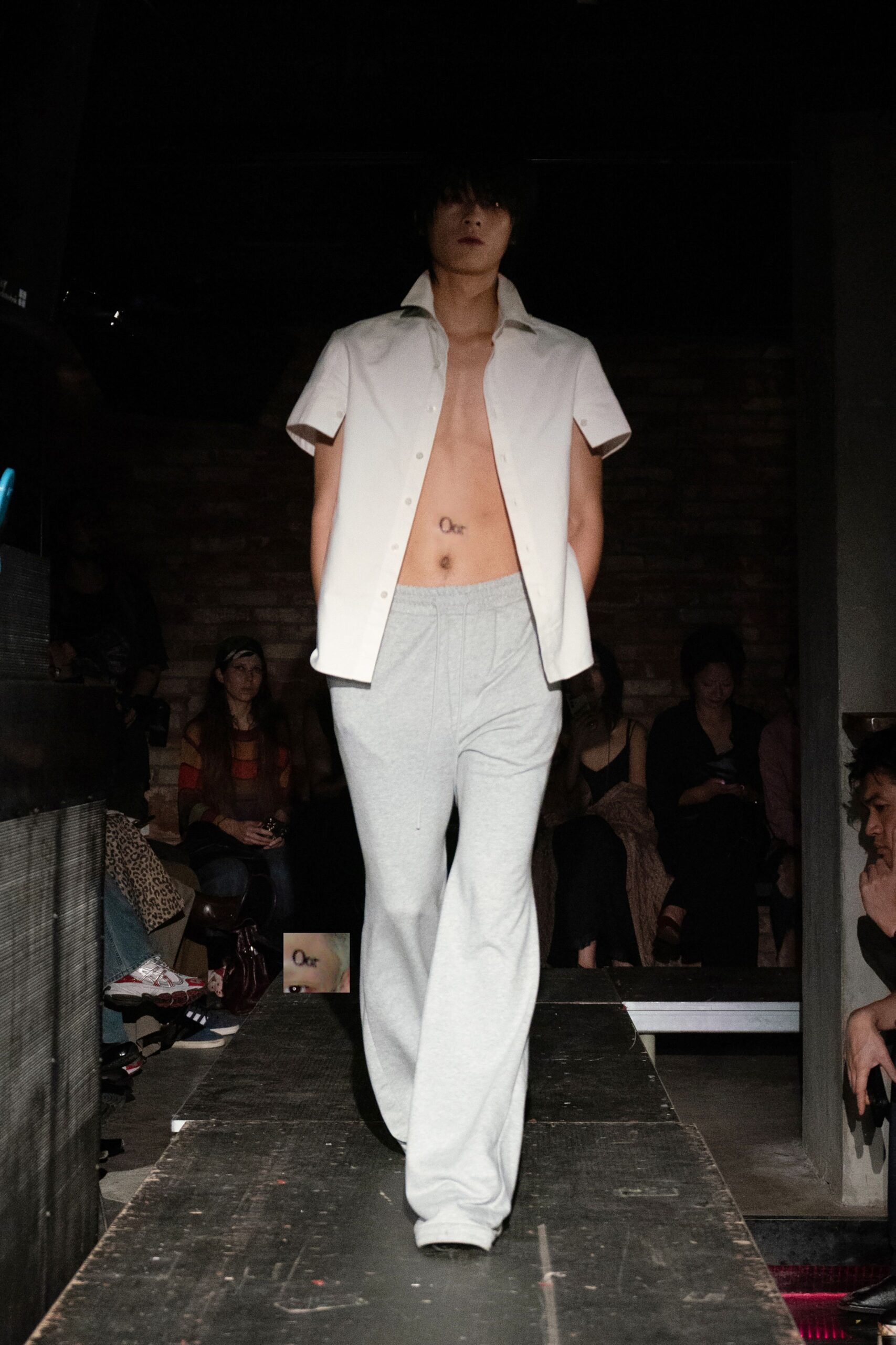 white short-sleeve shirt and gray pants