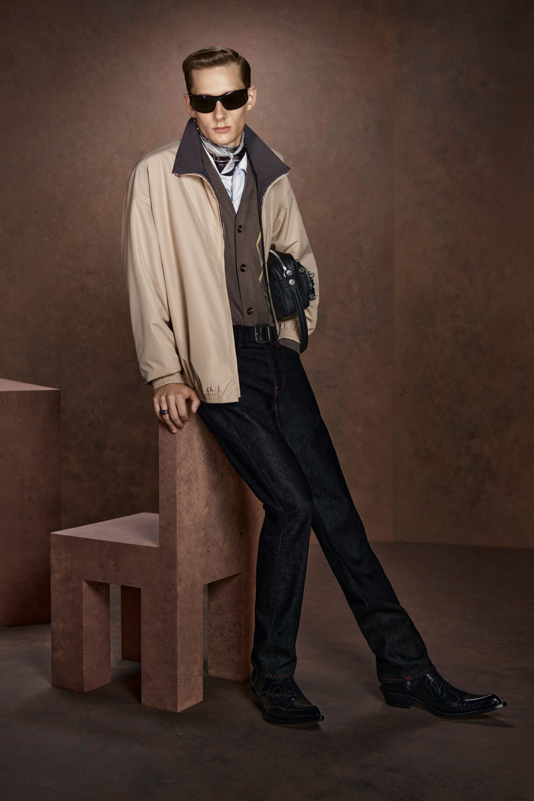 beige jacket brown vest black pants