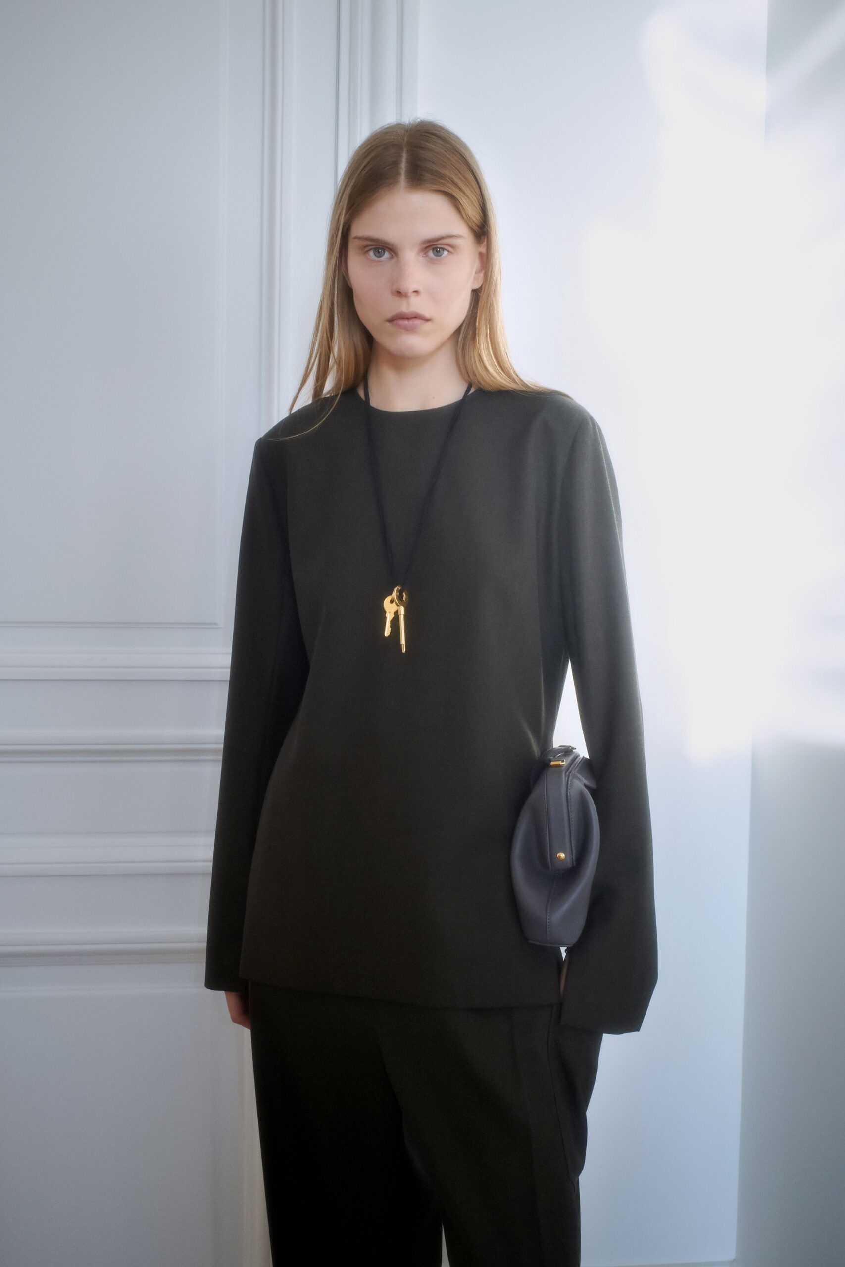 black fitted top and relaxed pants