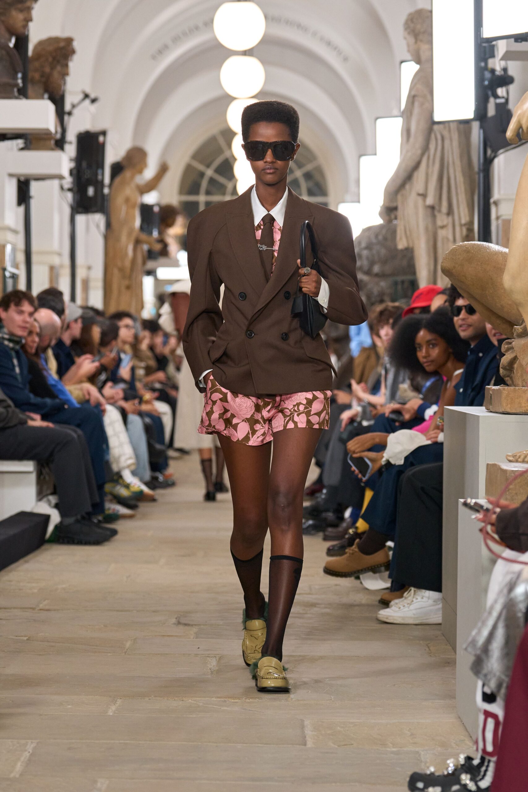 brown tailored blazer with pink flared skirt