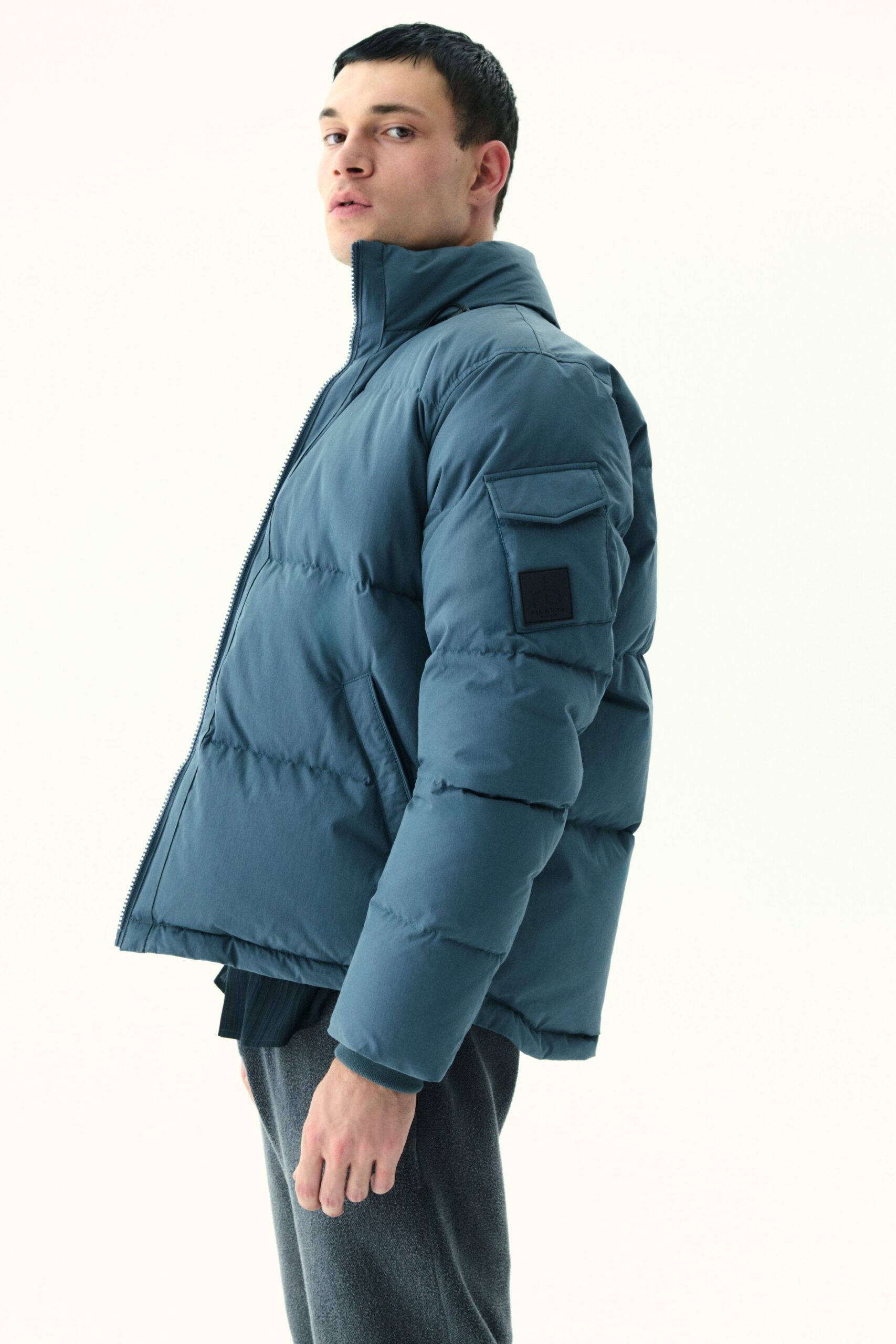blue relaxed jacket with gray pants