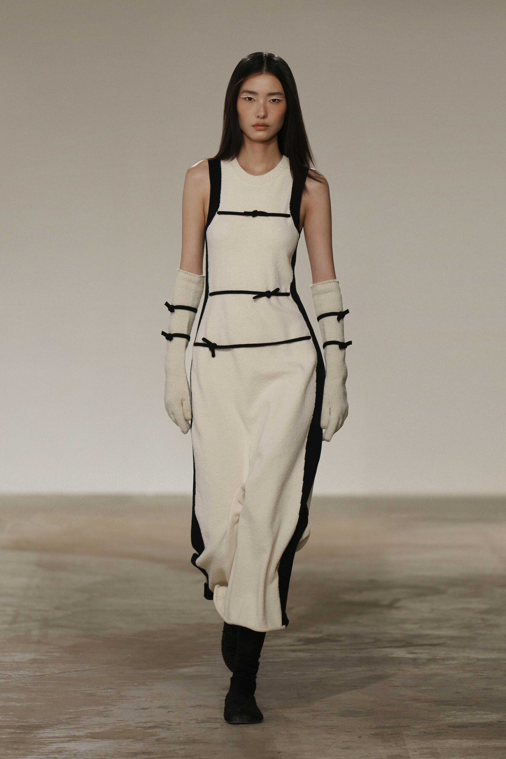 white and black fitted dress with gloves