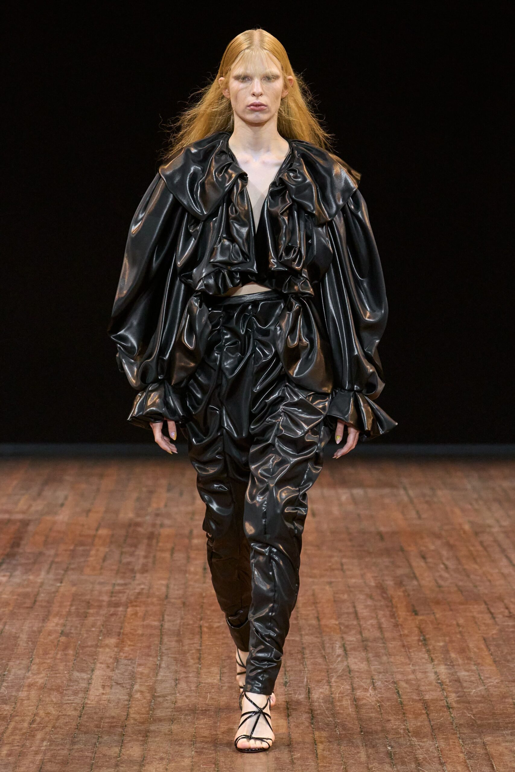 black leather long-sleeve v-neck relaxed ruffled top
