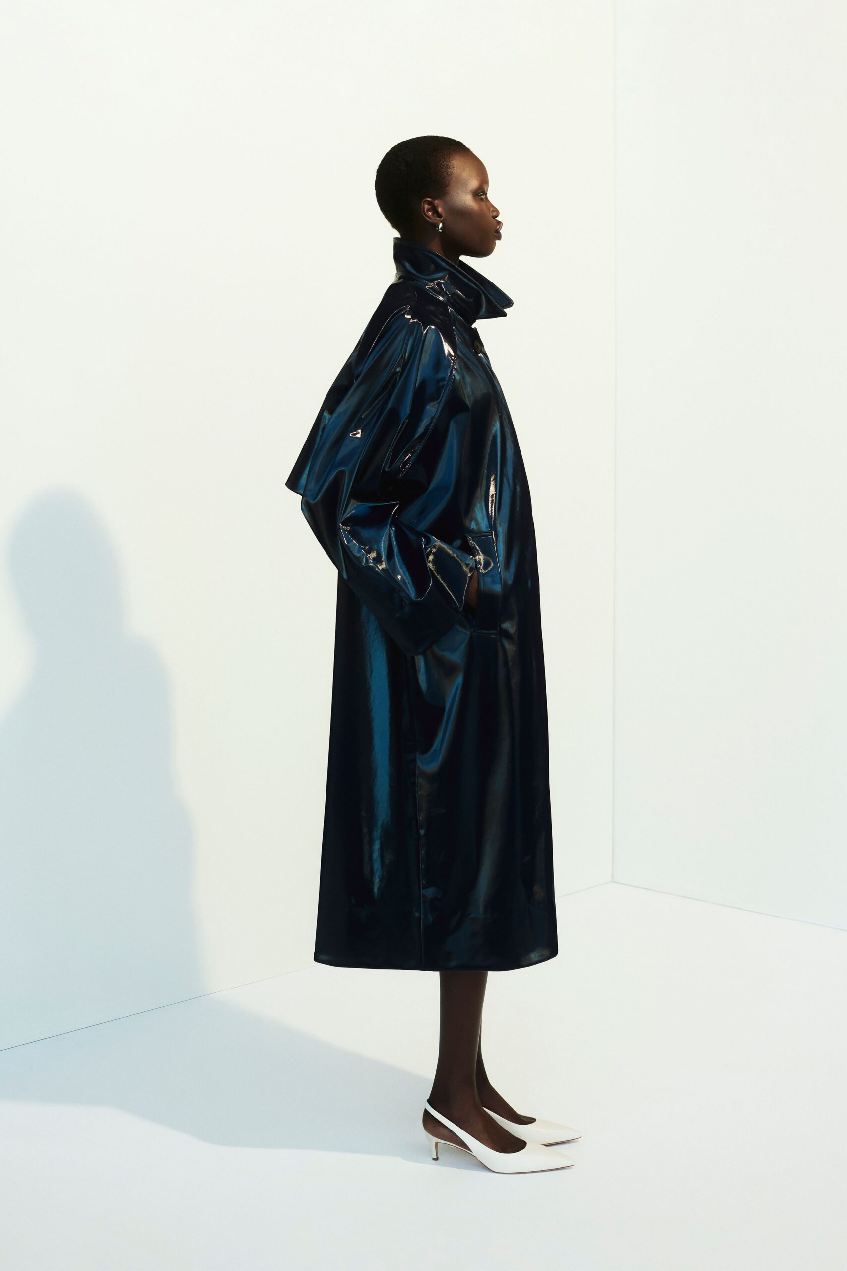 blue vinyl long-sleeve collared relaxed zippered shiny coat