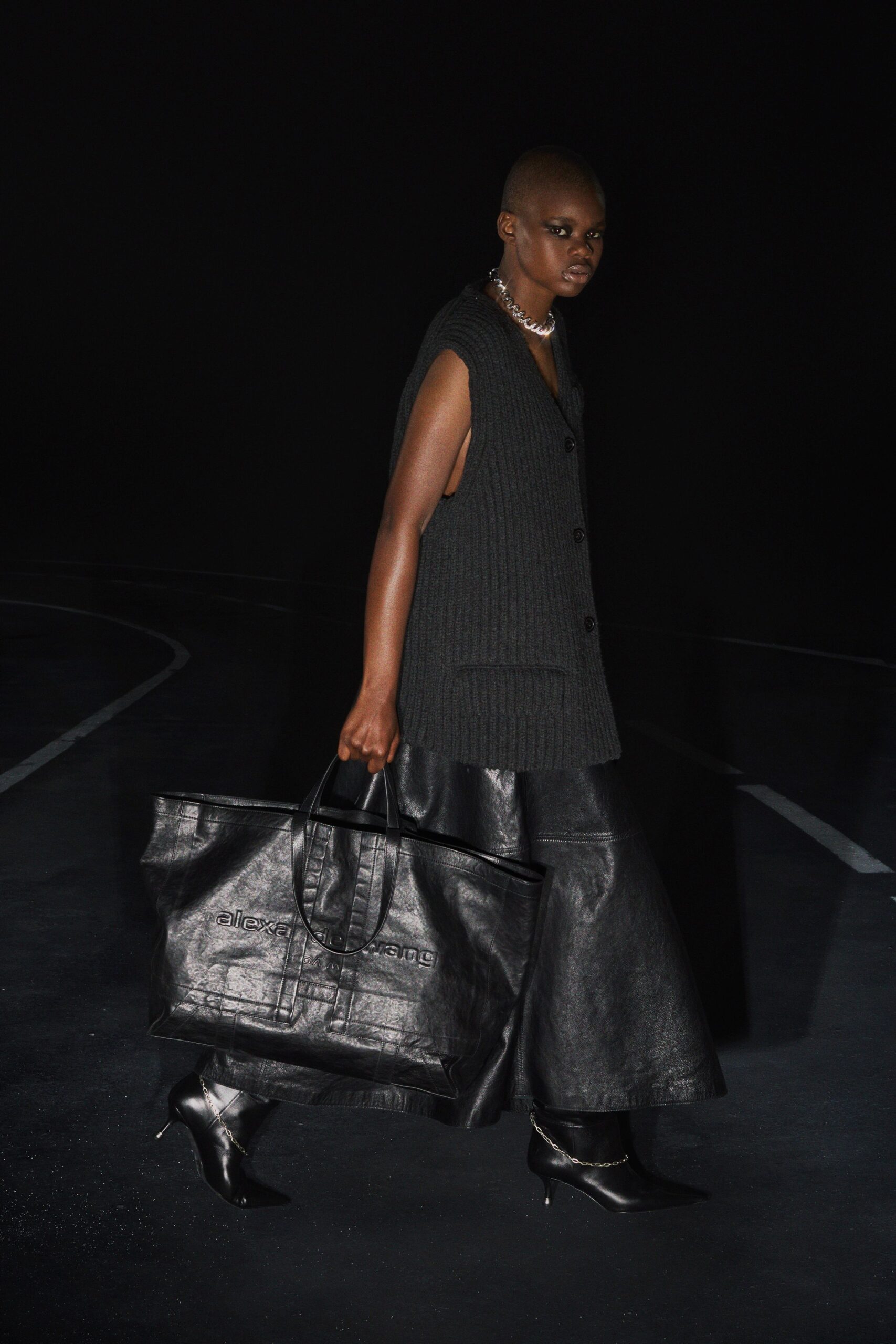 black wool sleeveless collared relaxed buttoned vest