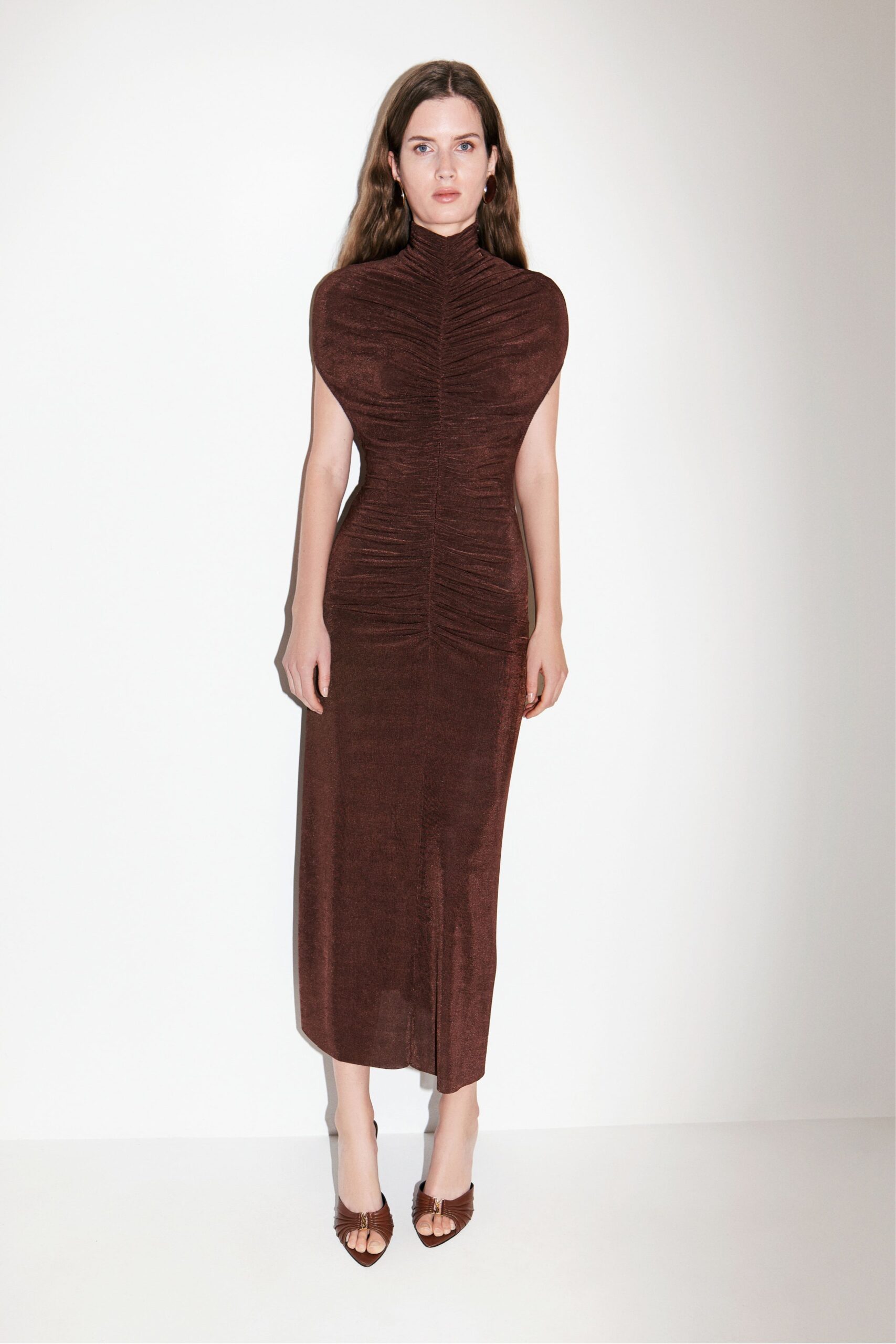 brown velvet fitted gown with open-toe shoes