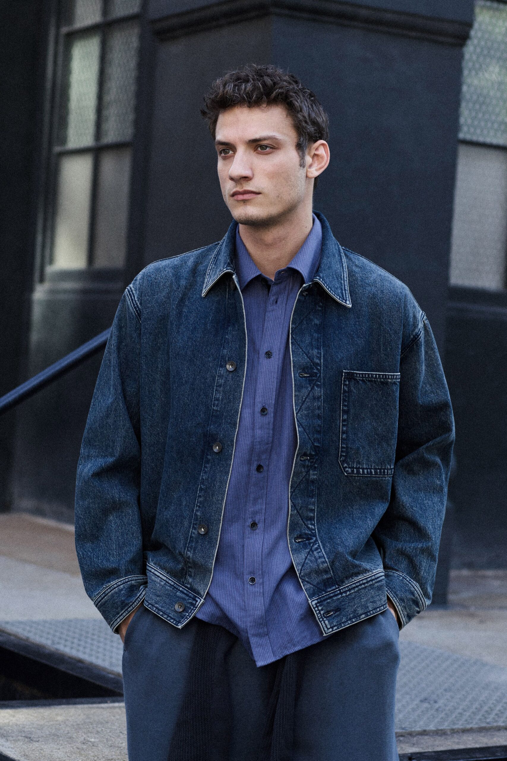 blue denim jacket with shirt and gray pants