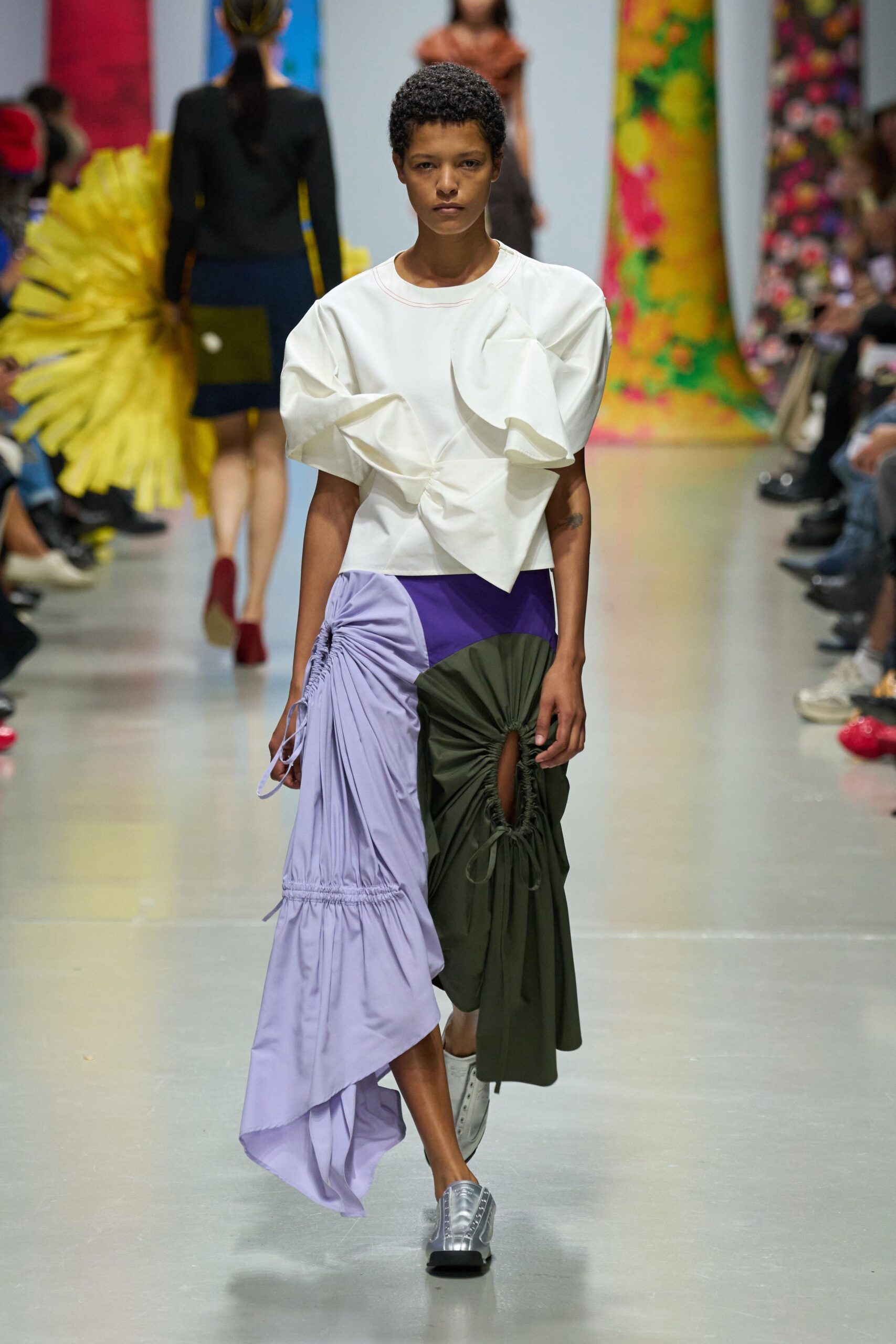 white pleated top with asymmetric skirt