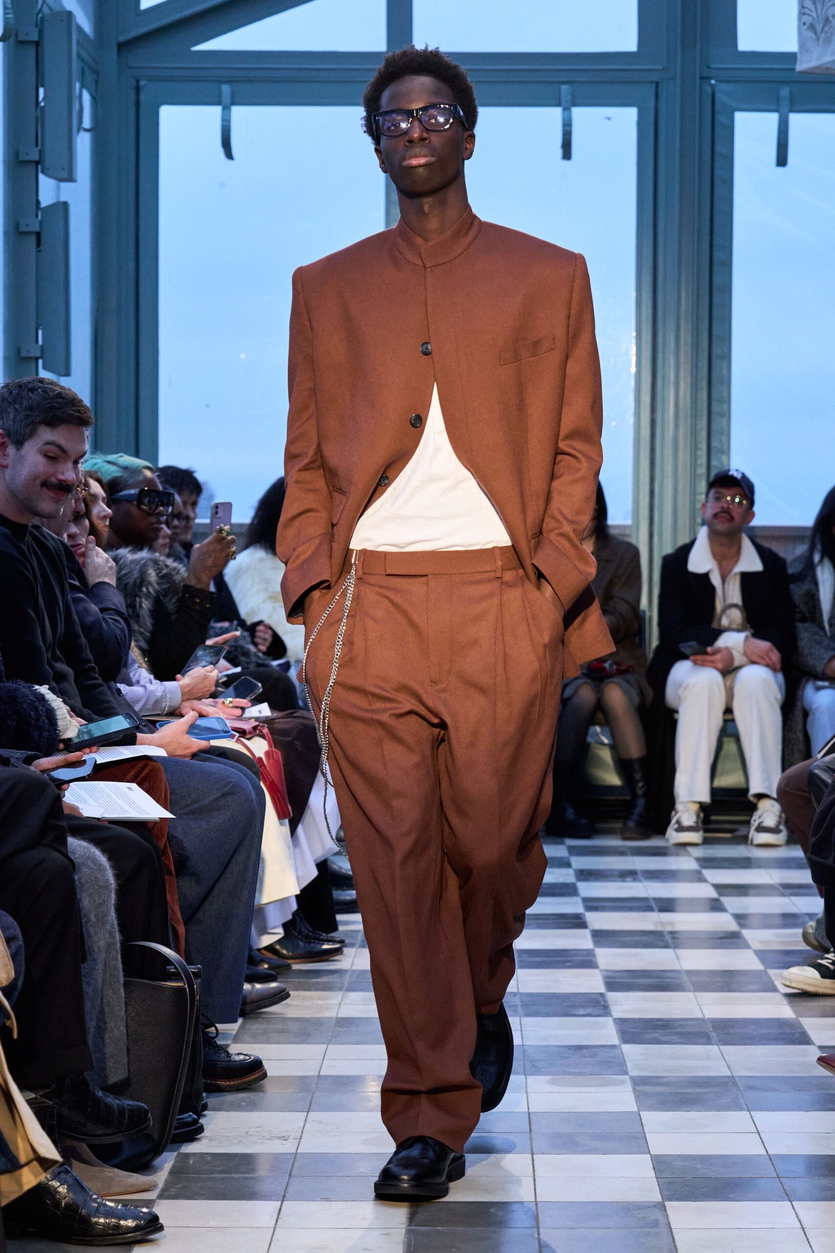 brown tailored suit with white t-shirt