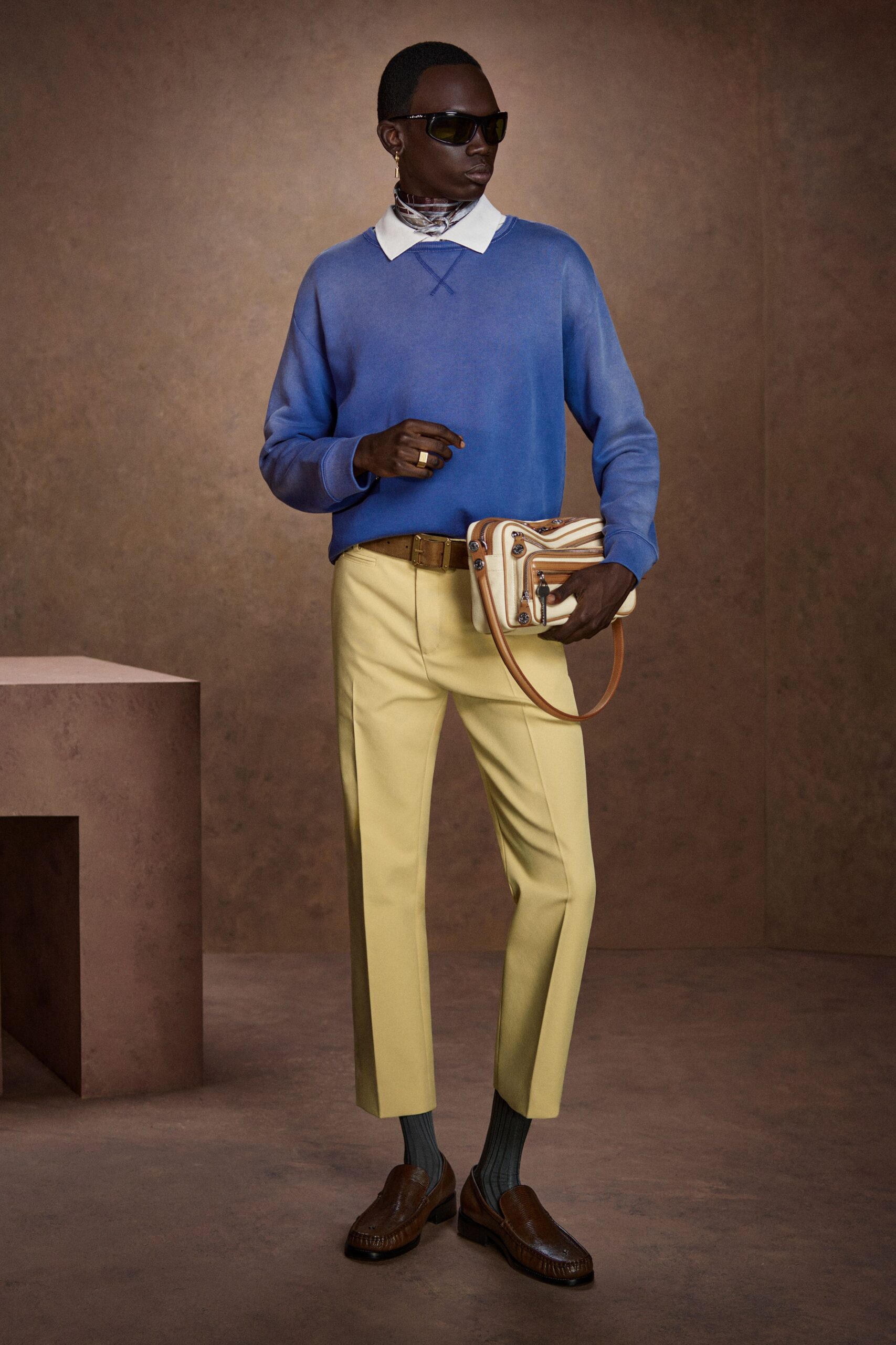 blue relaxed sweater with yellow pants