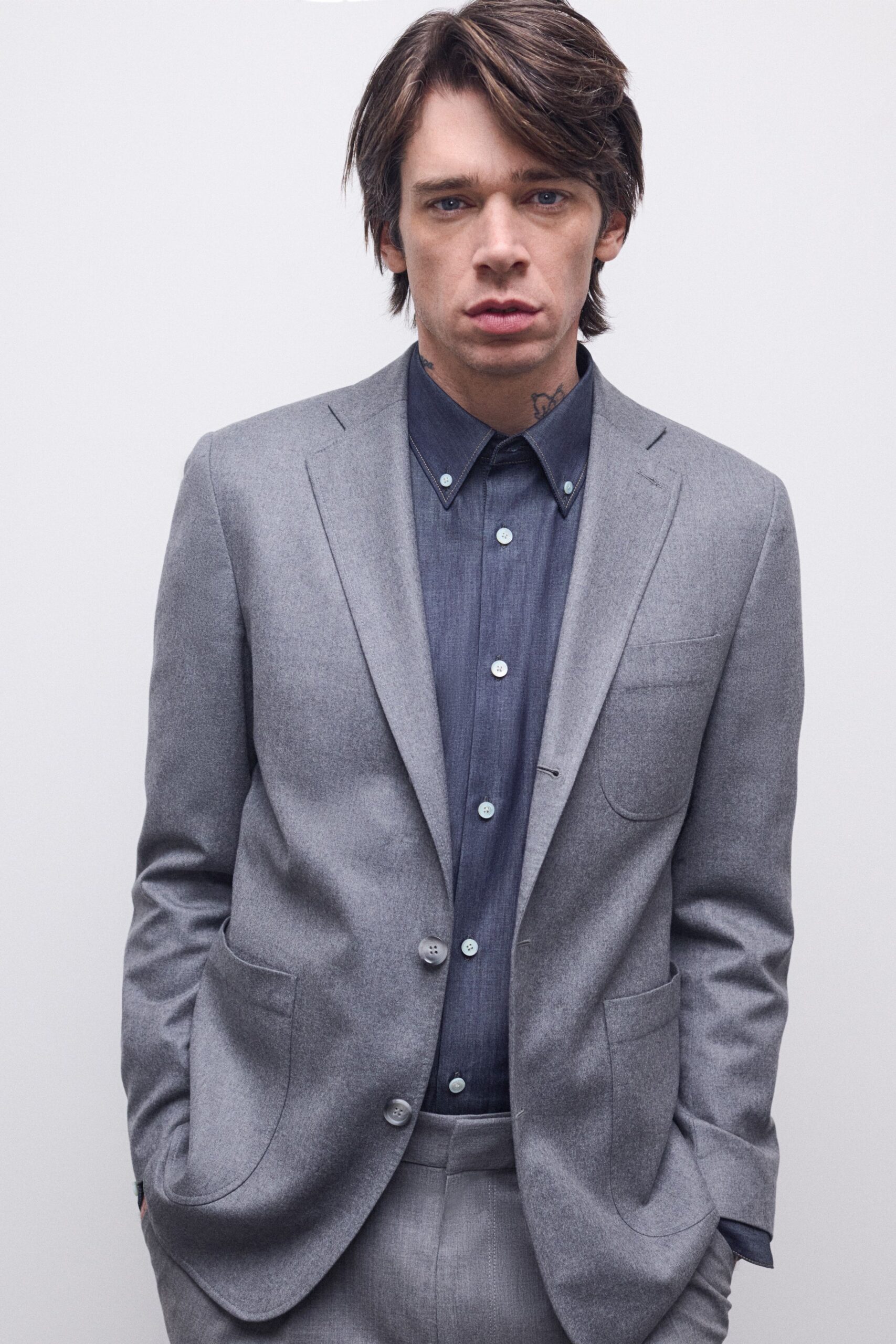 gray tailored blazer and blue shirt