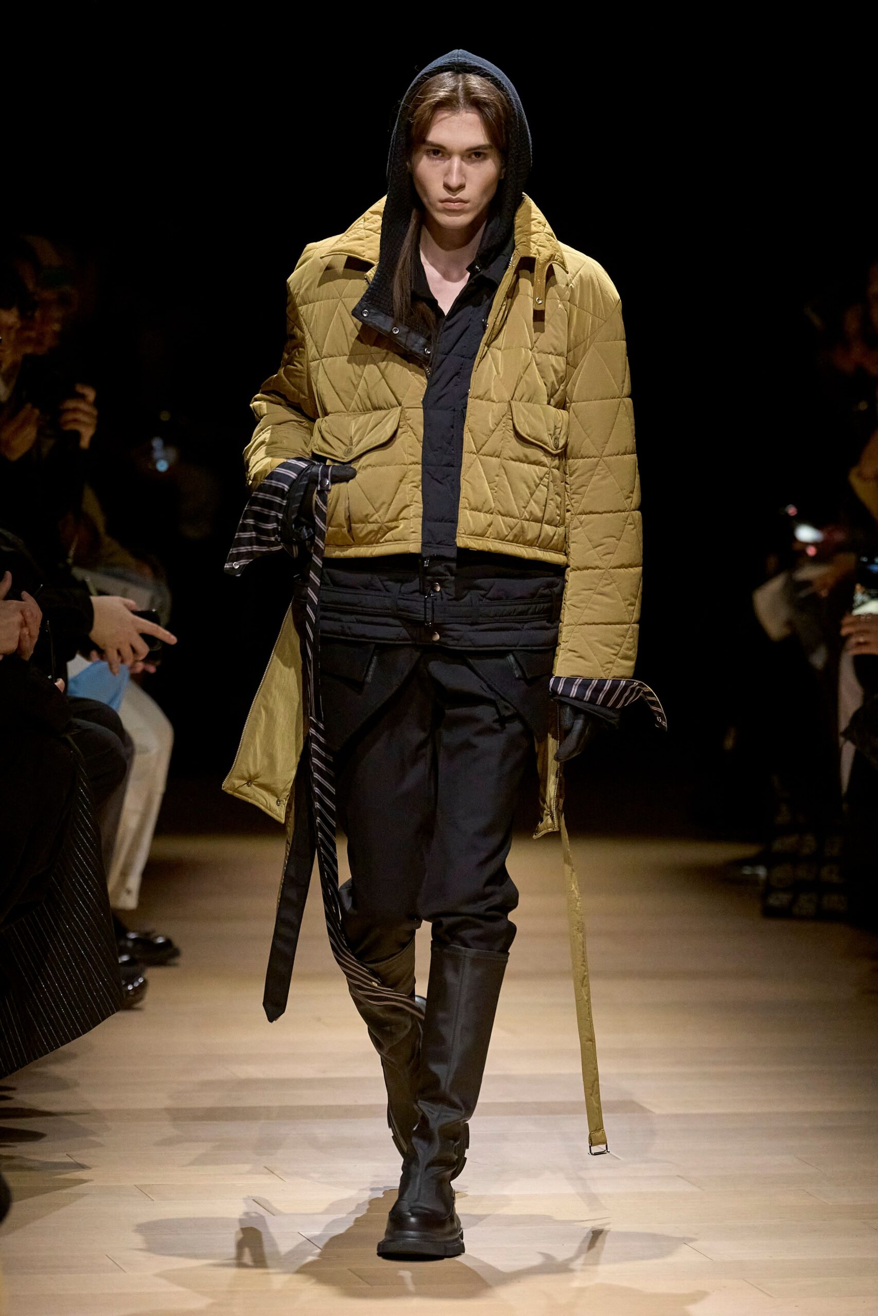 gold quilted jacket with black shirt and pants