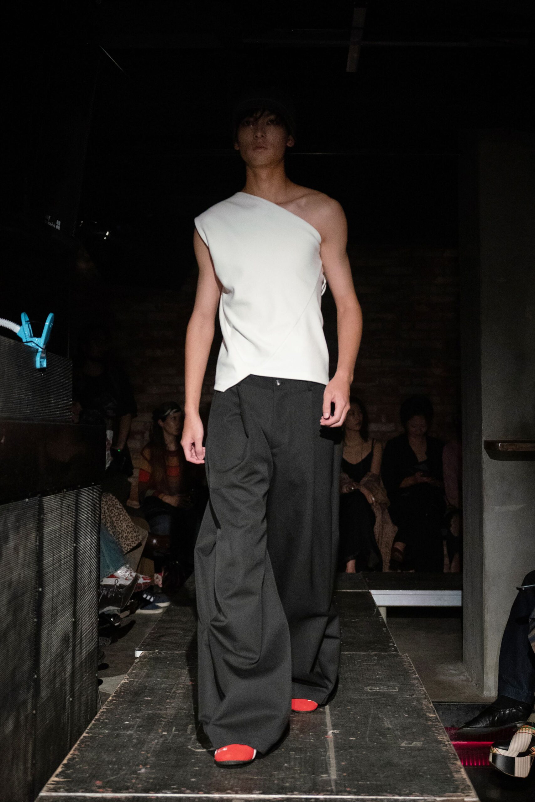 white sleeveless asymmetric fitted top