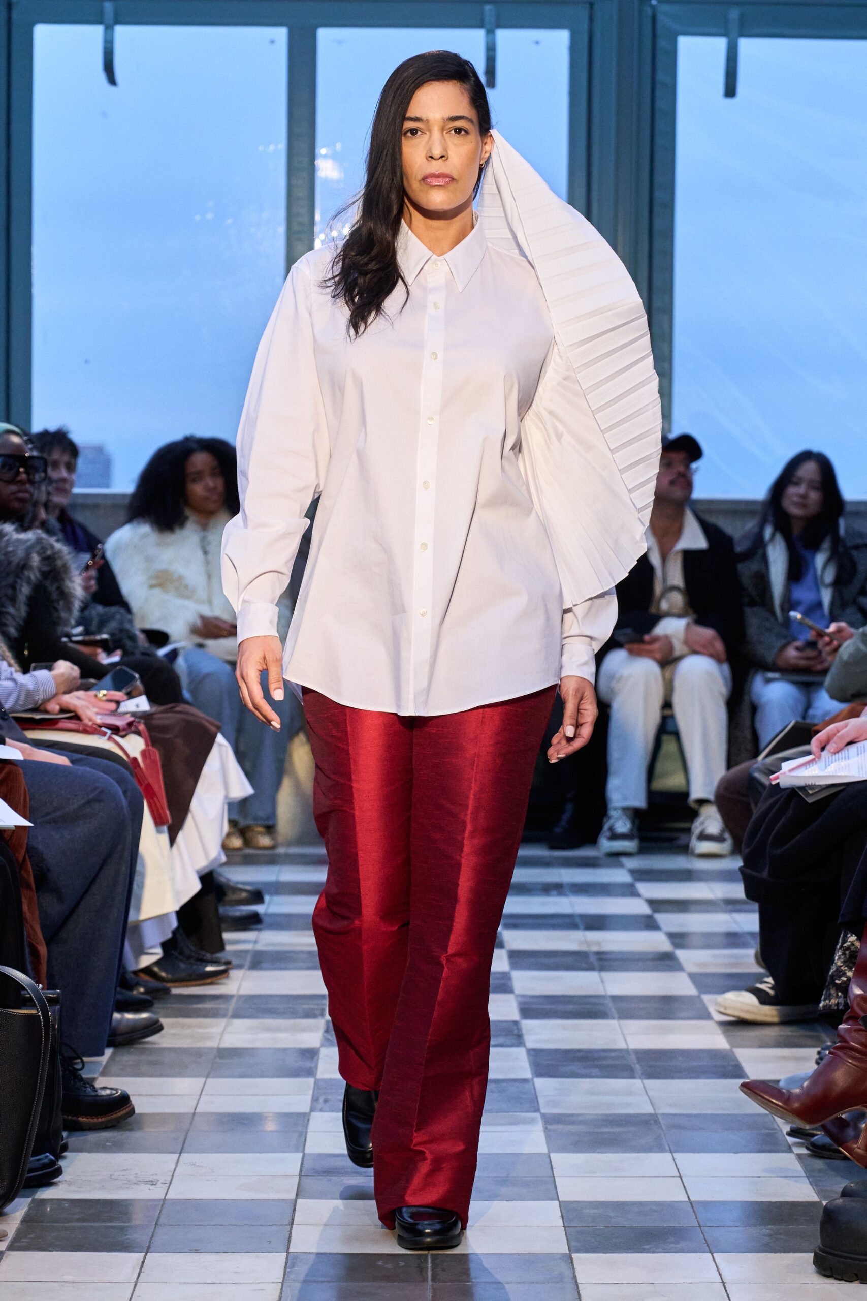white pleated shirt red tailored pants