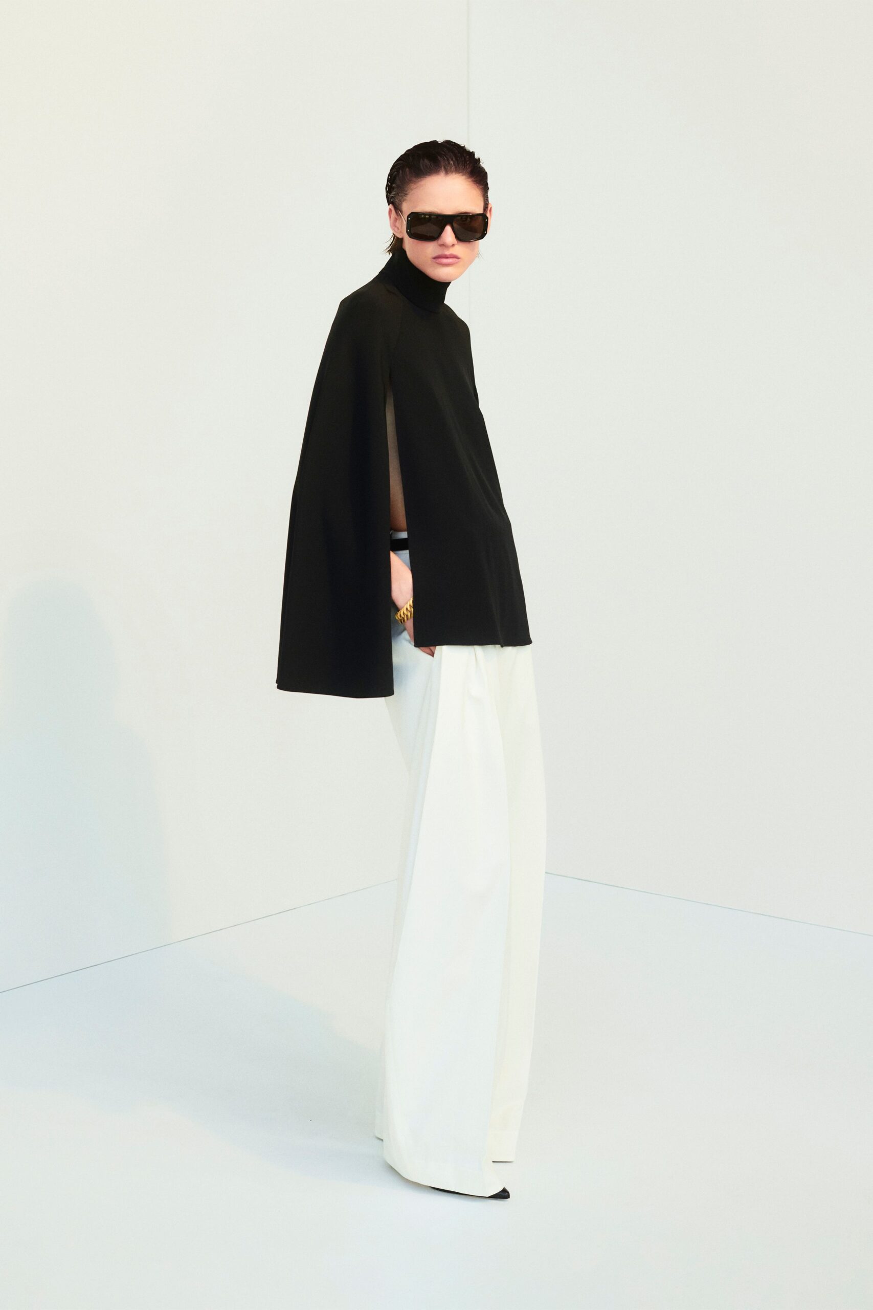 black fitted top white wide-leg pants