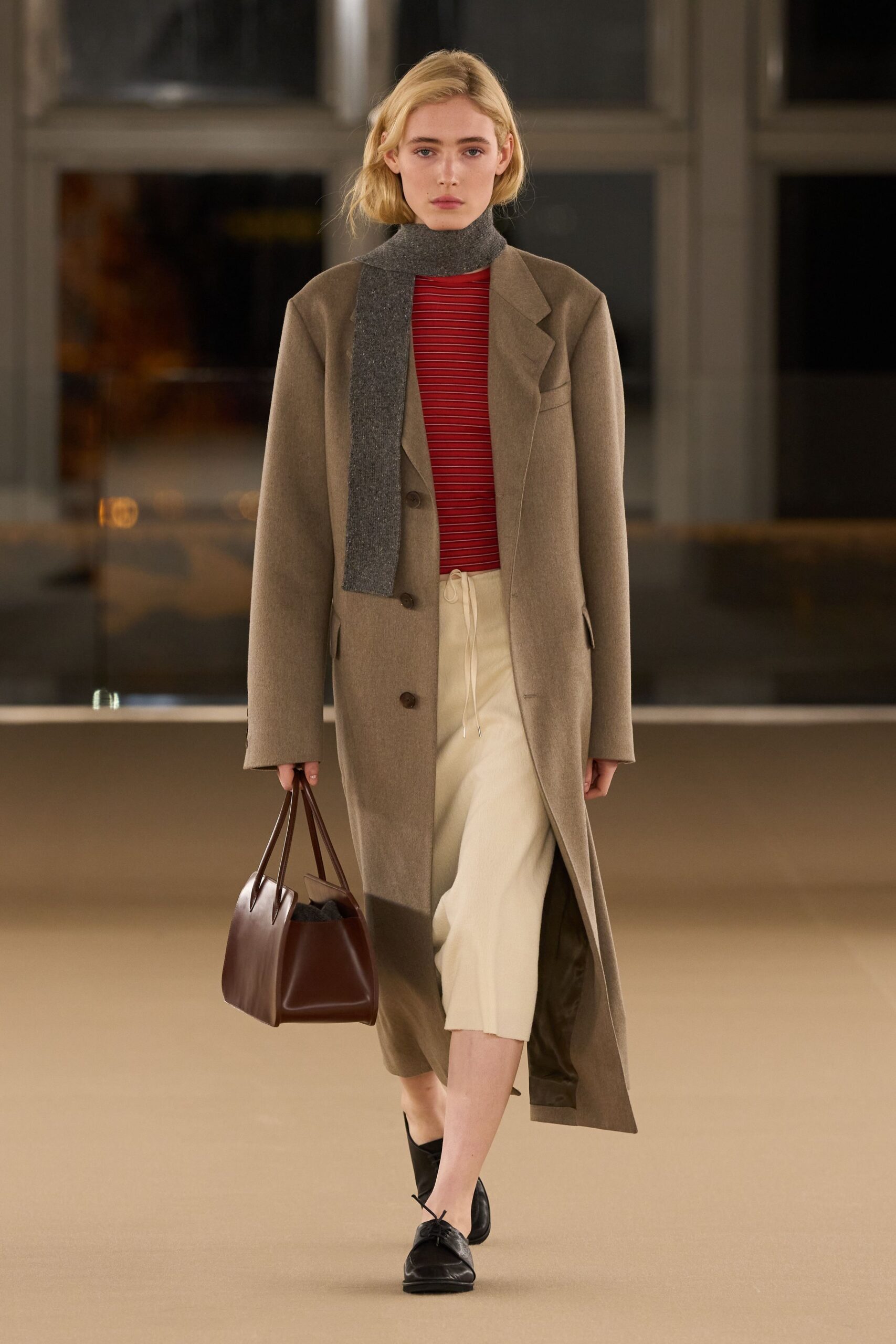 beige wool coat with red top