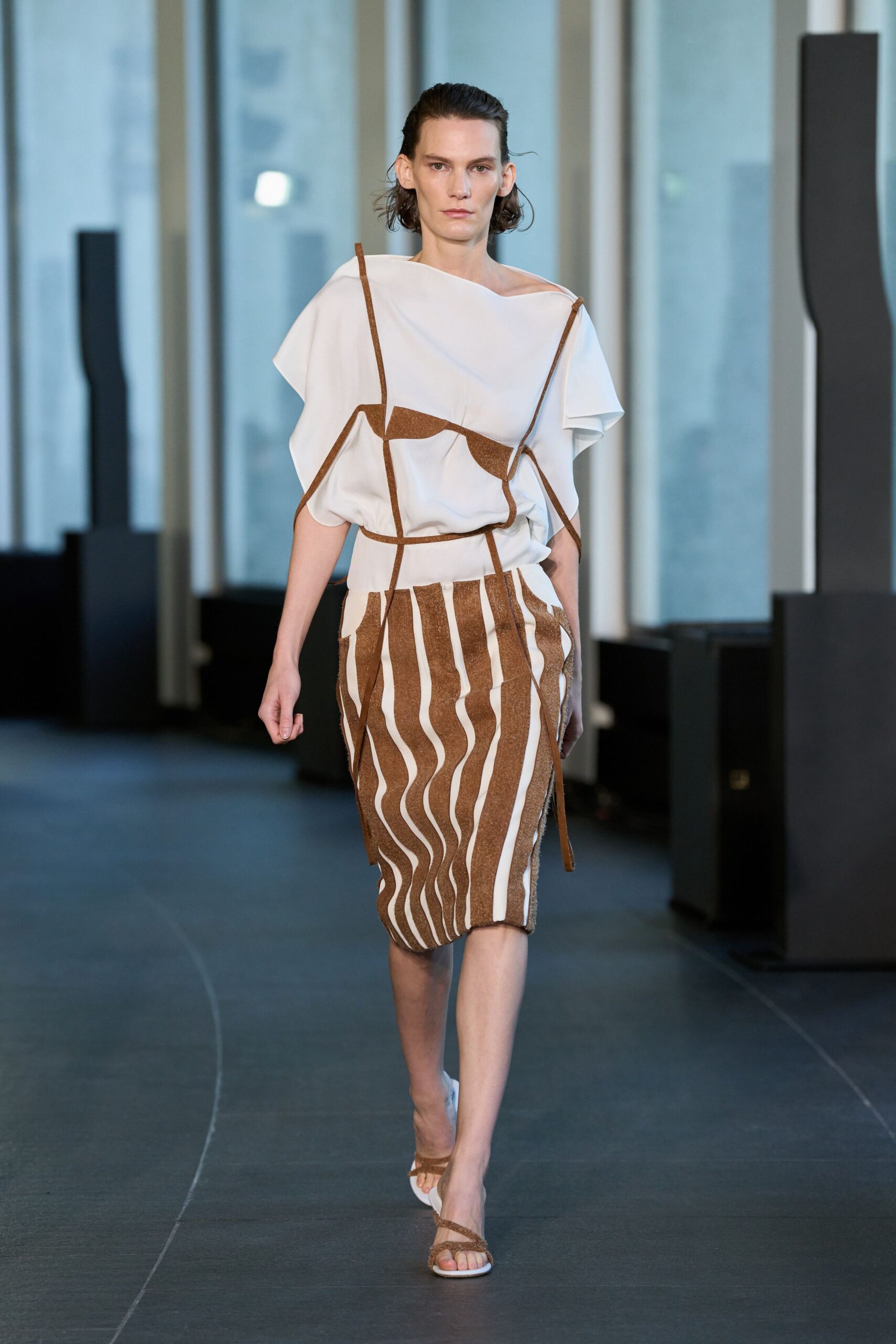 white relaxed top with striped skirt