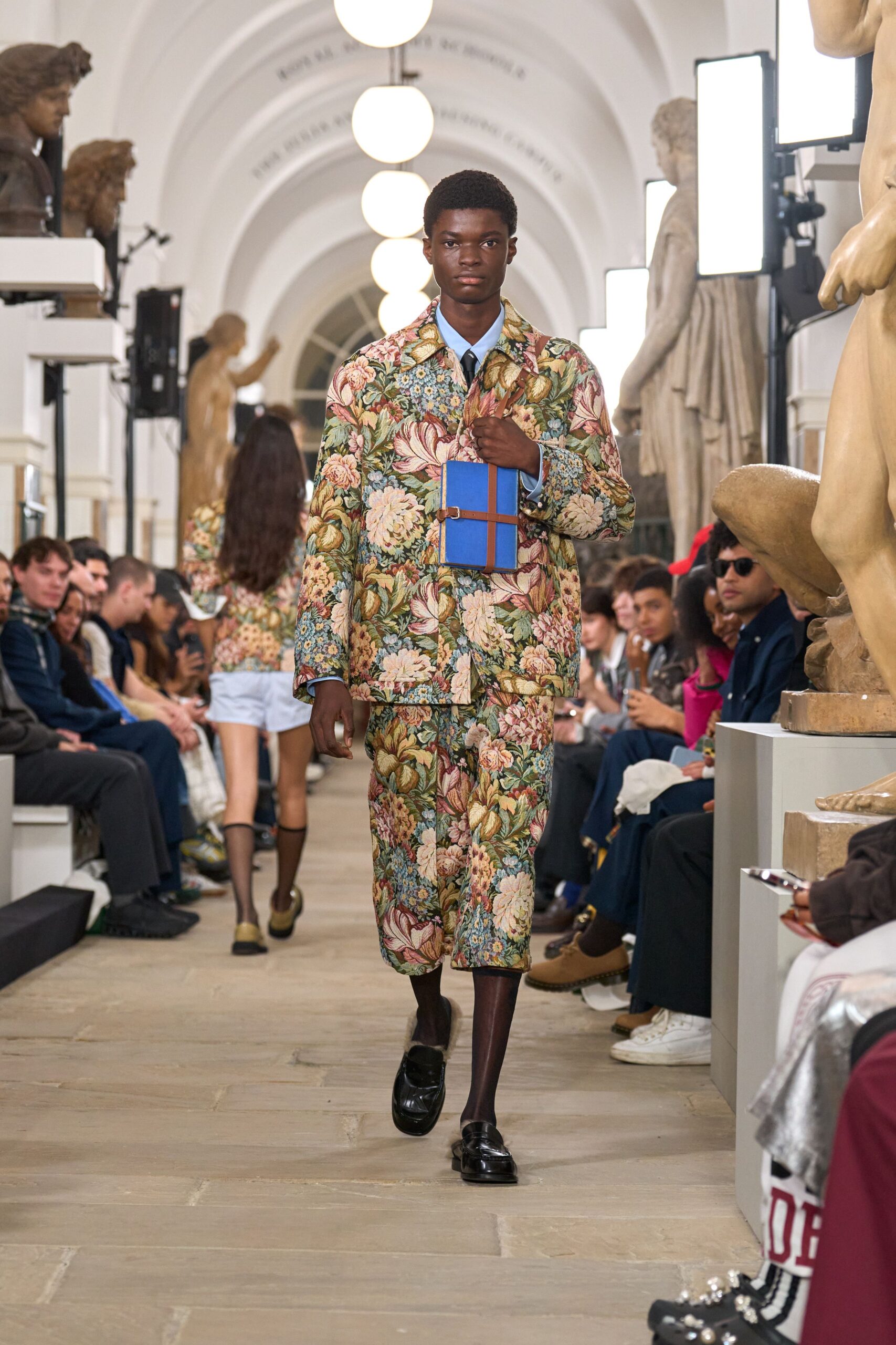 floral suit with black shoes
