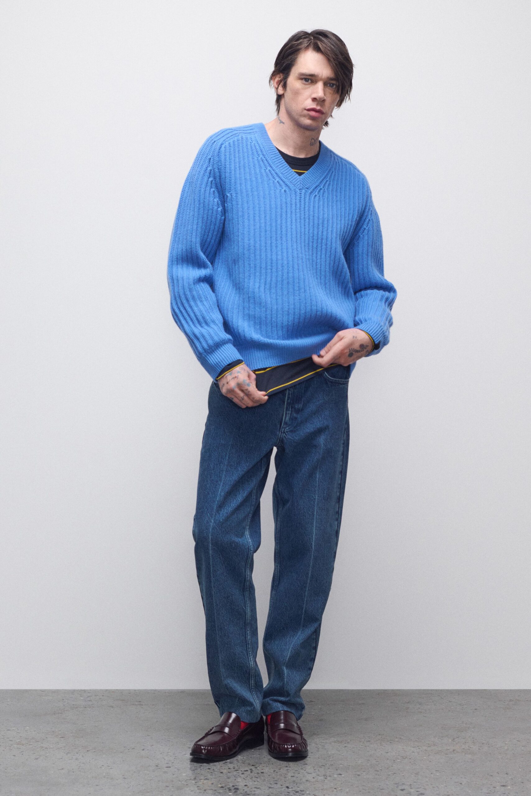 blue relaxed sweater with denim pants