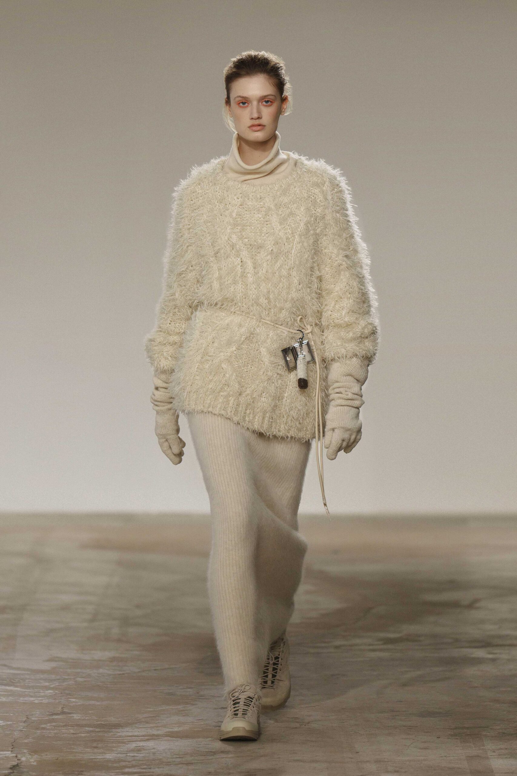white wool sweater with beige pants
