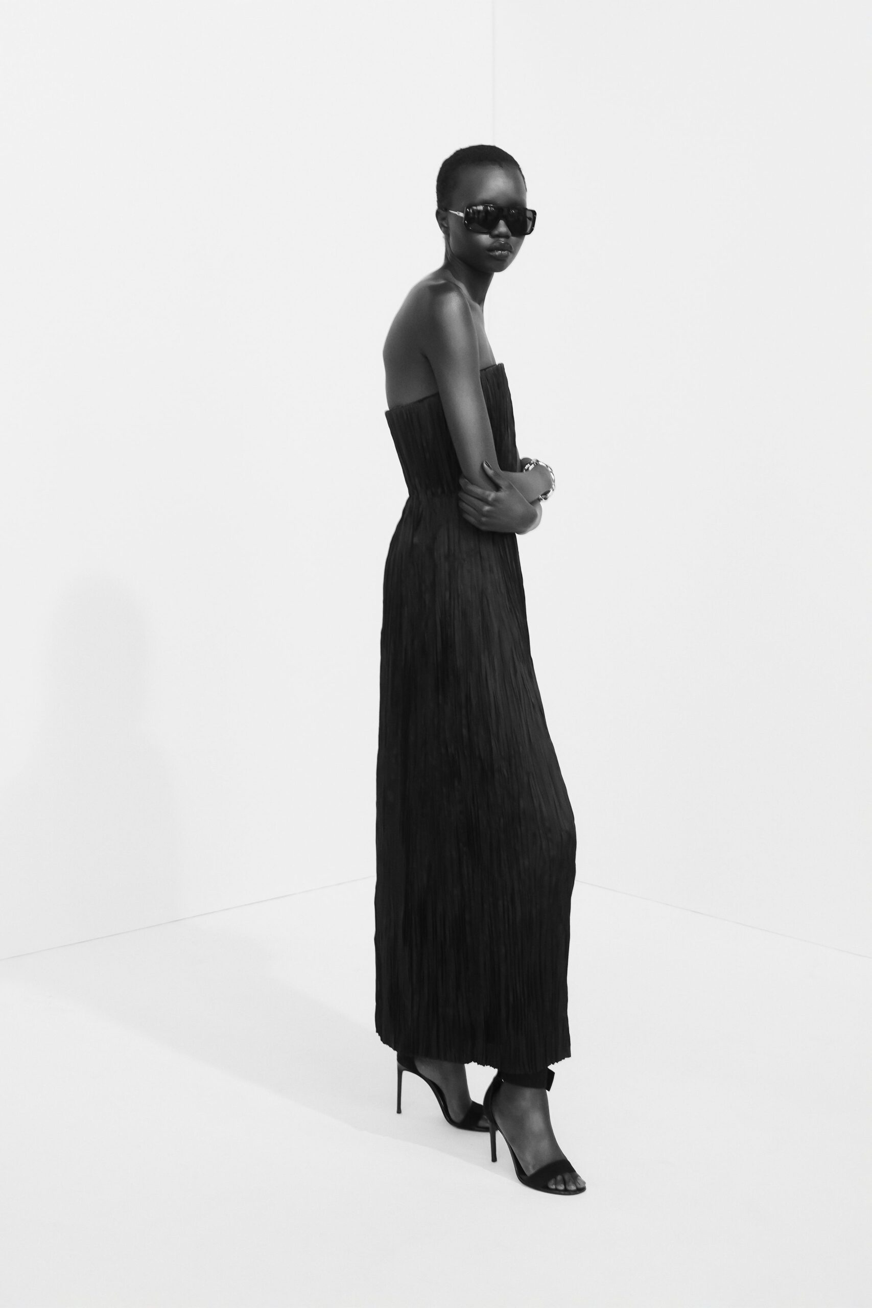 black pleated strapless gown
