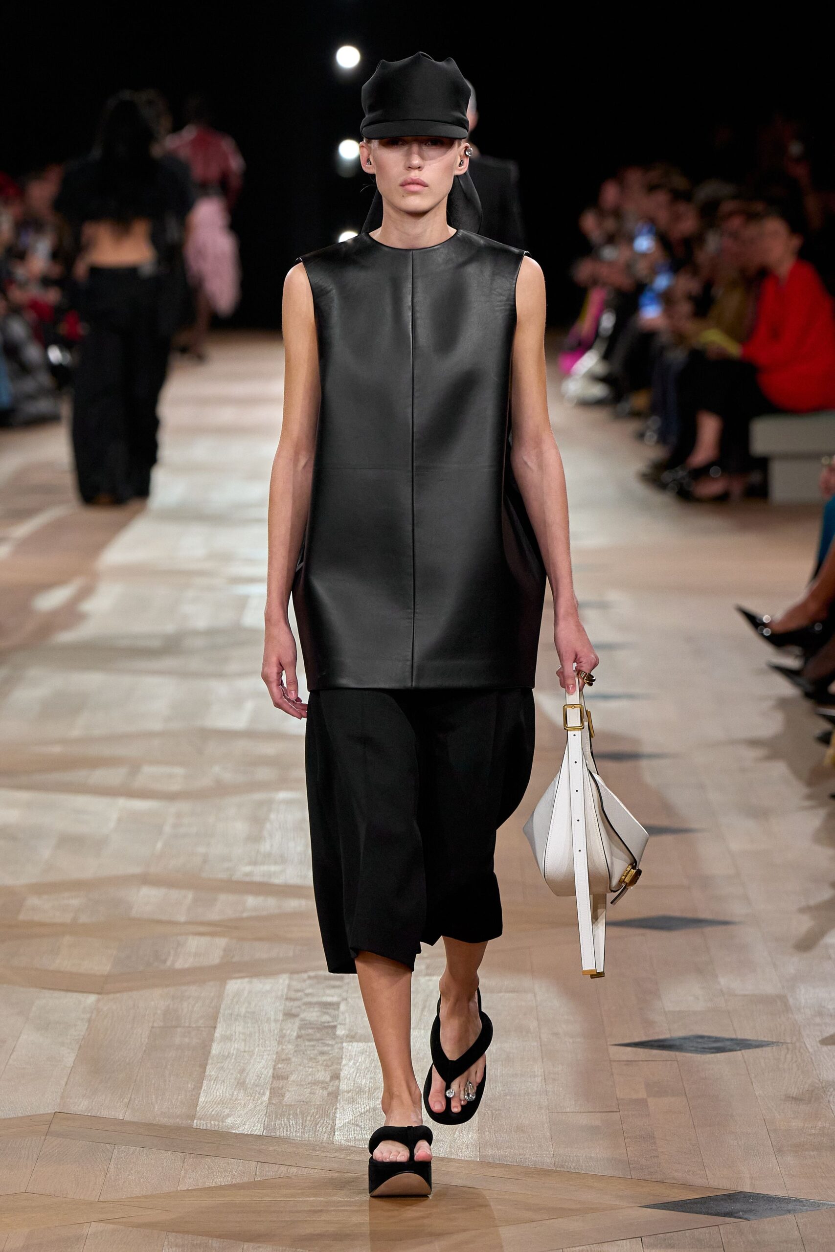 black leather sleeveless high-neck oversized top