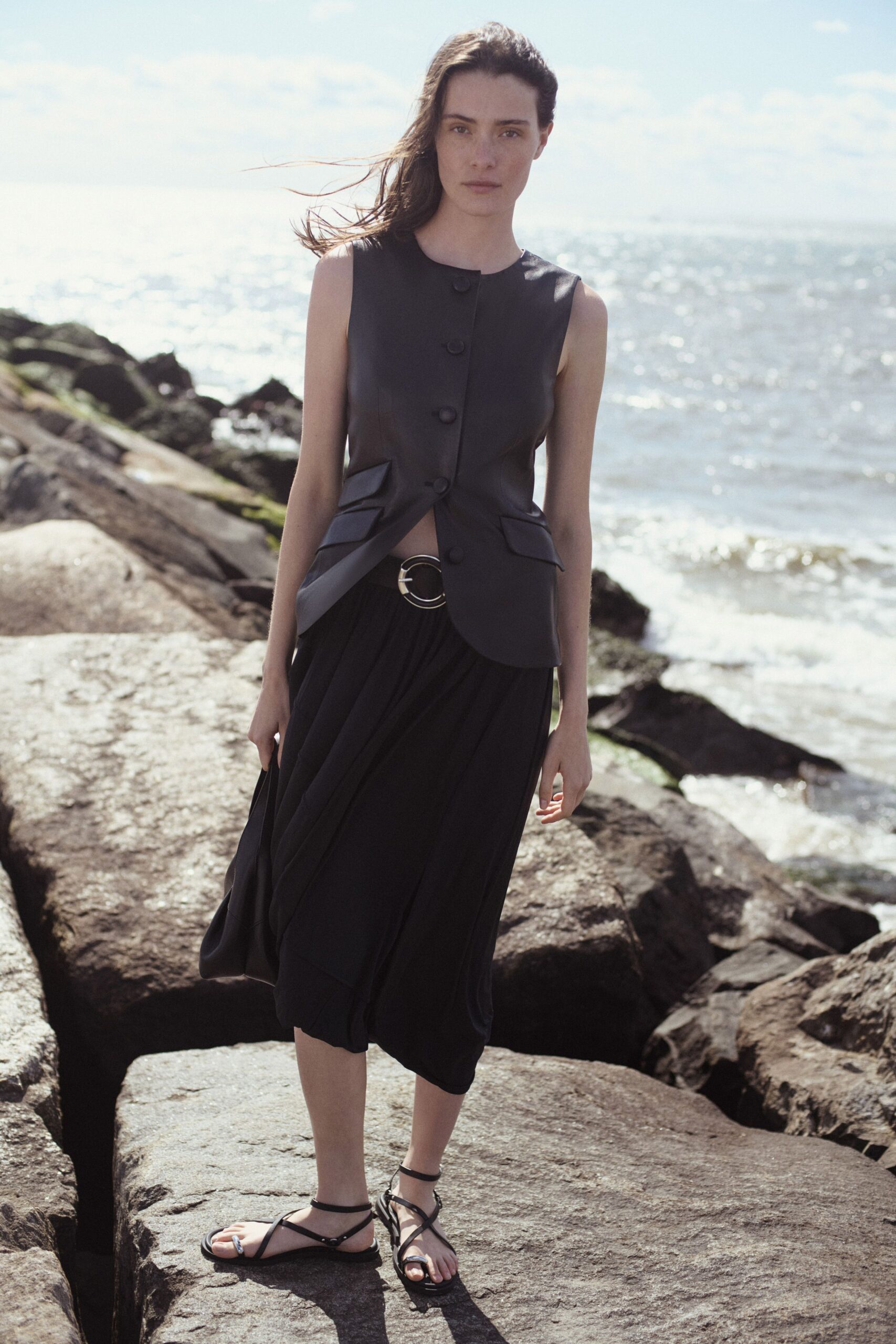 black leather vest and relaxed skirt
