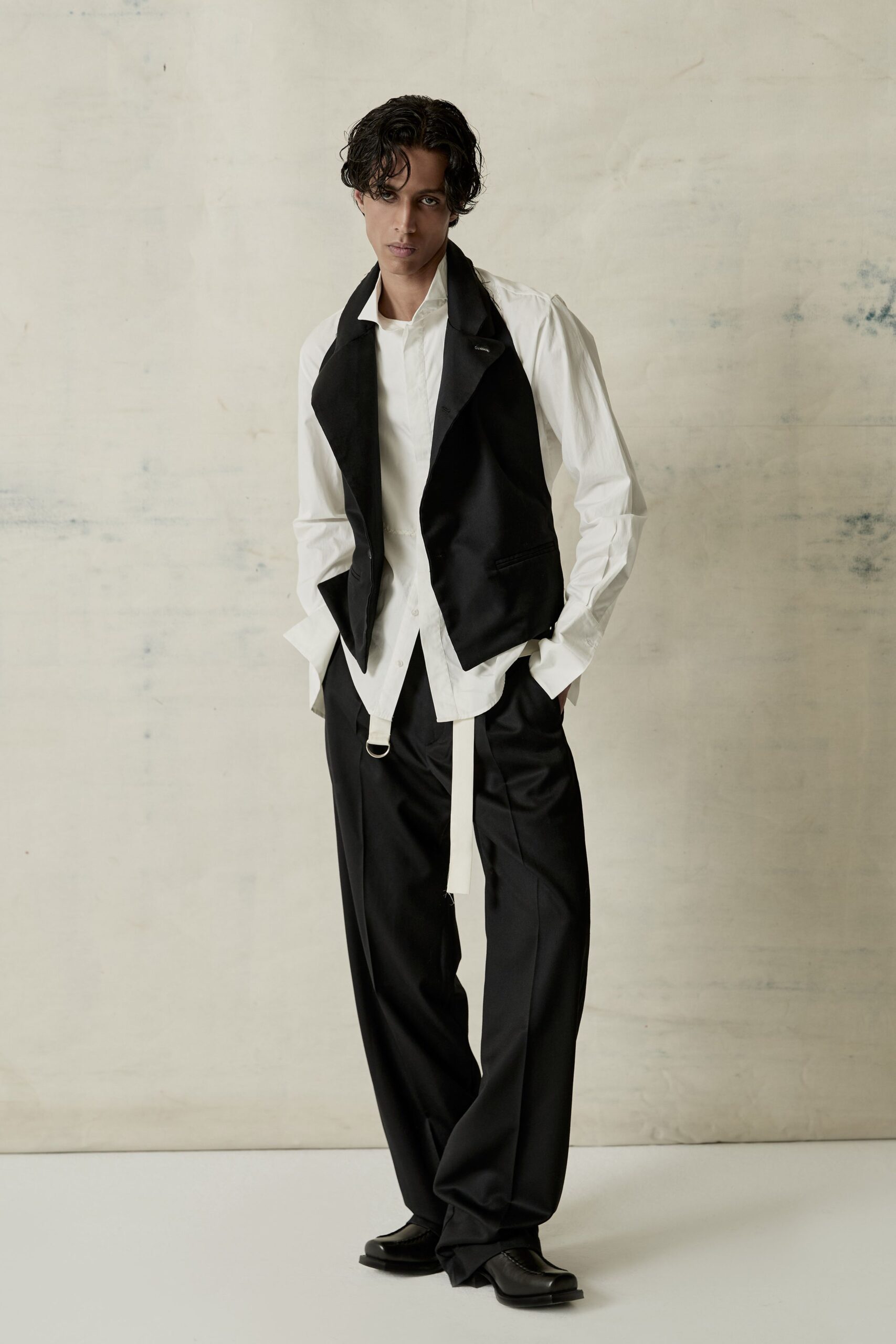 black vest white shirt relaxed pants