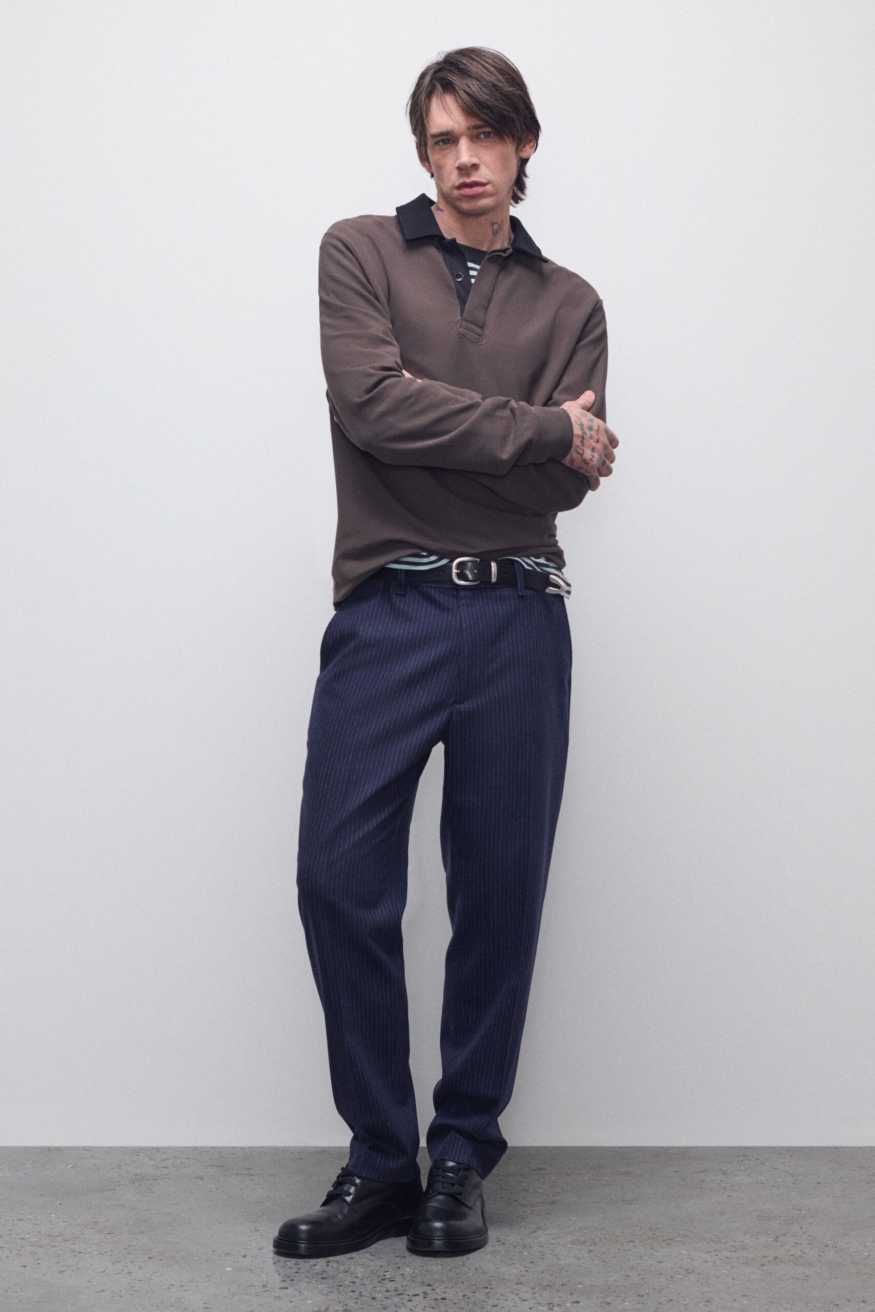 brown relaxed shirt with navy tailored pants
