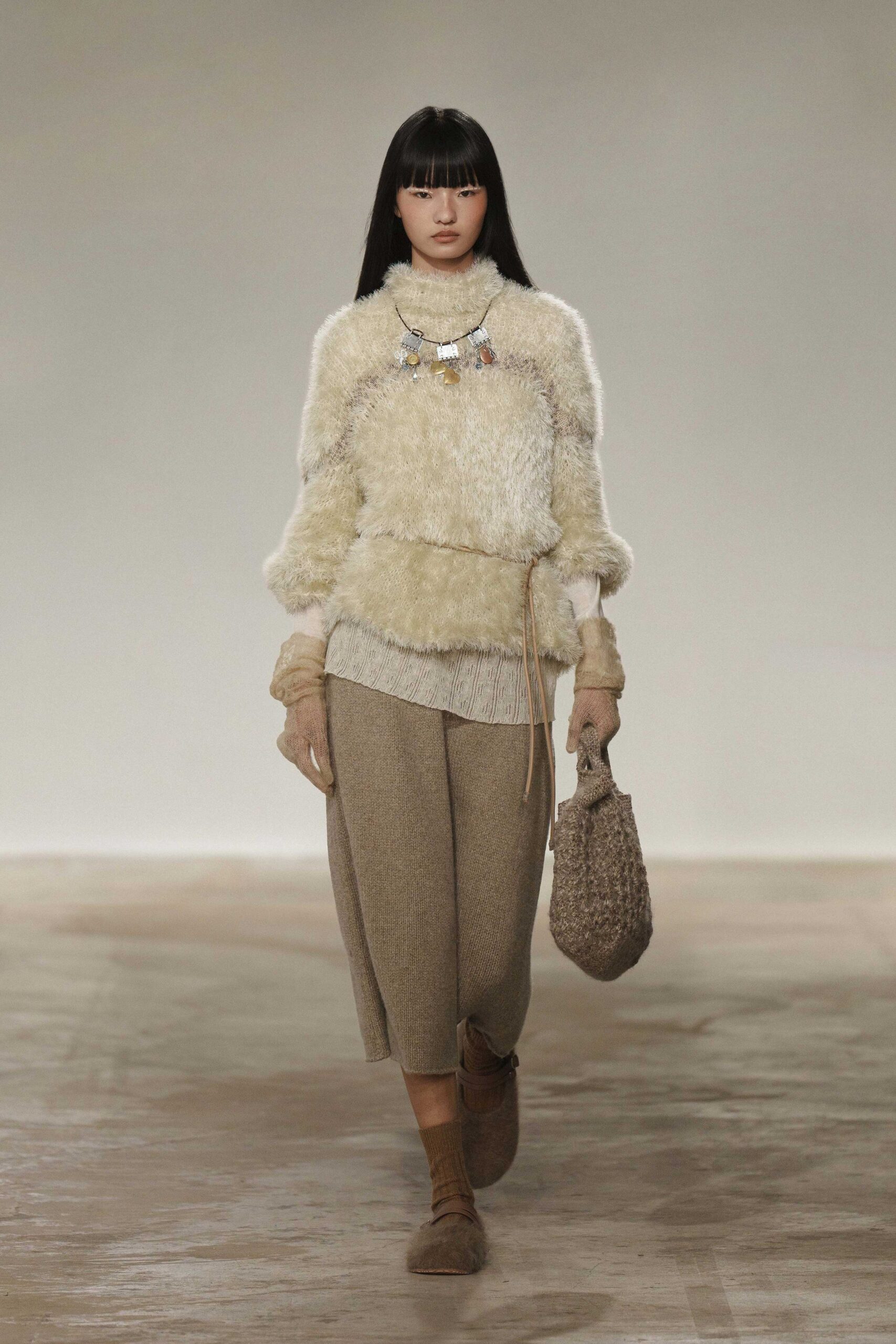 beige faux-fur sweater with brown pants