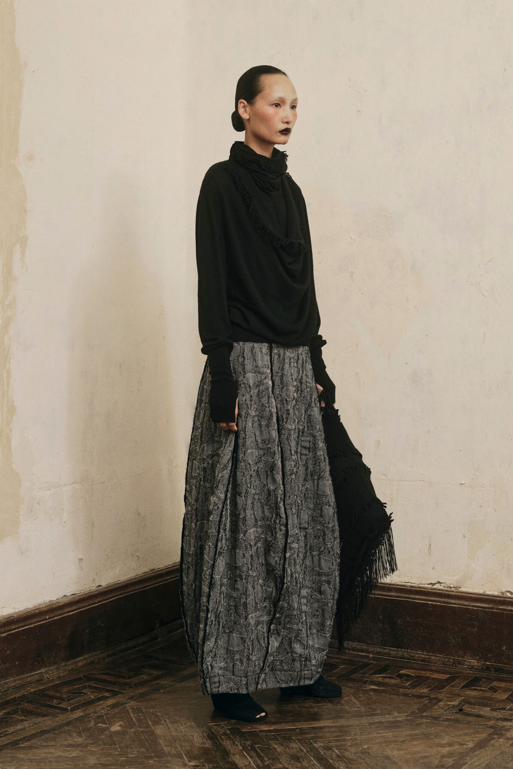 black wool long-sleeve high-neck relaxed draped top