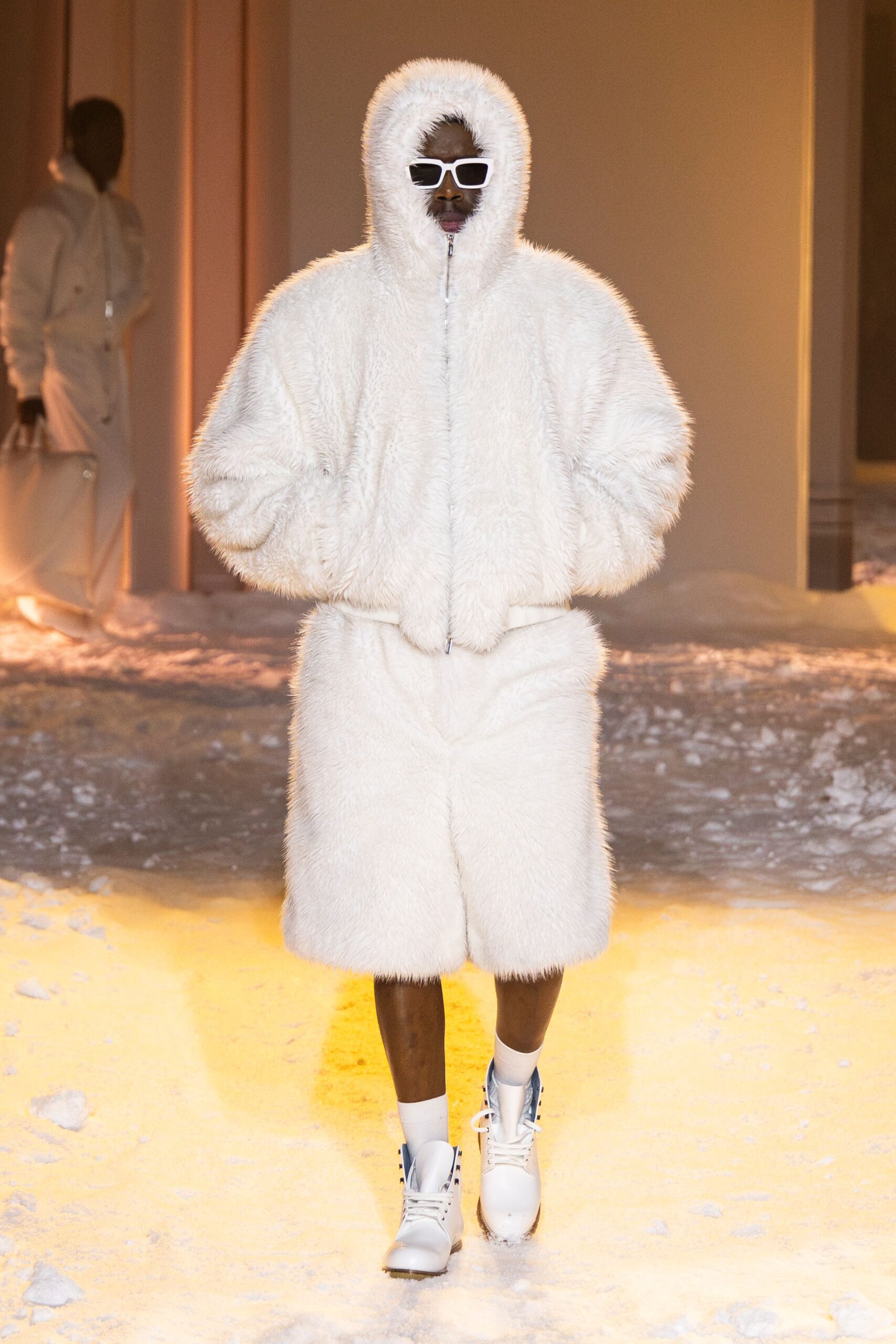 white faux-fur coat and shorts