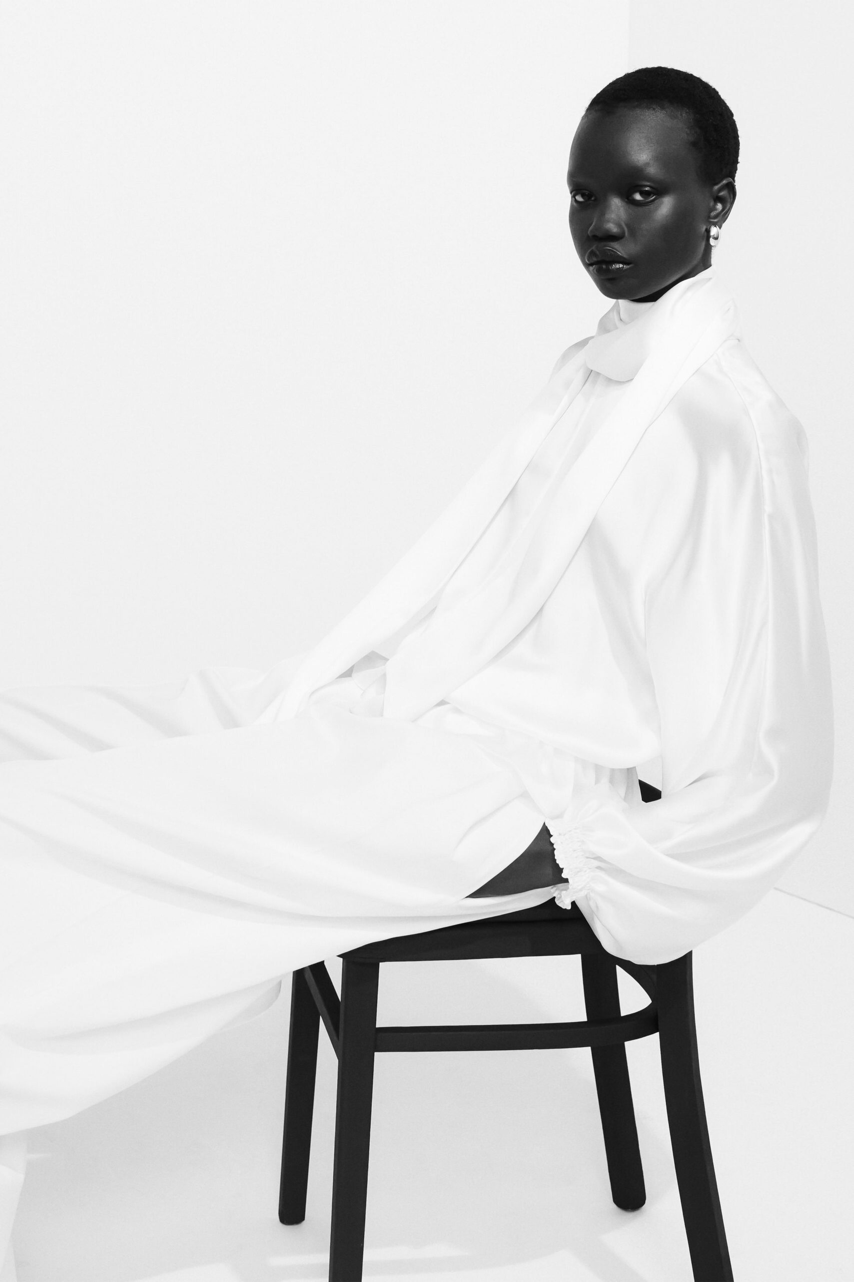 white silk long-sleeve collared relaxed blouse
