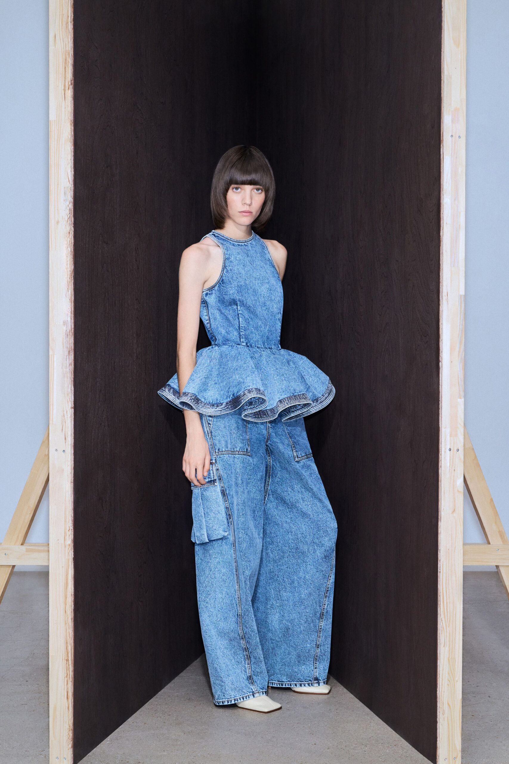 blue denim sleeveless high-neck fitted pleated jumpsuit