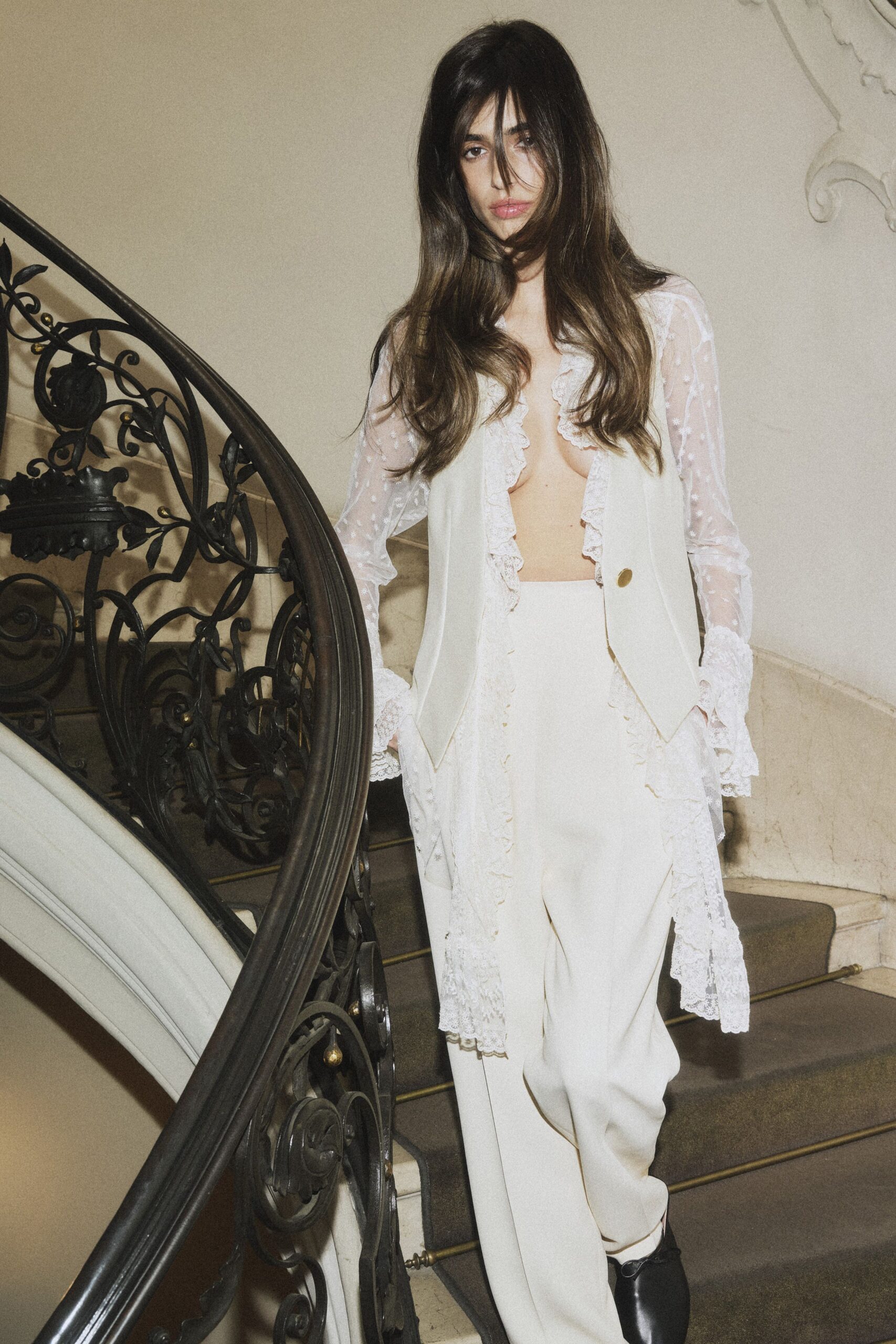 white silk blouse and relaxed pants
