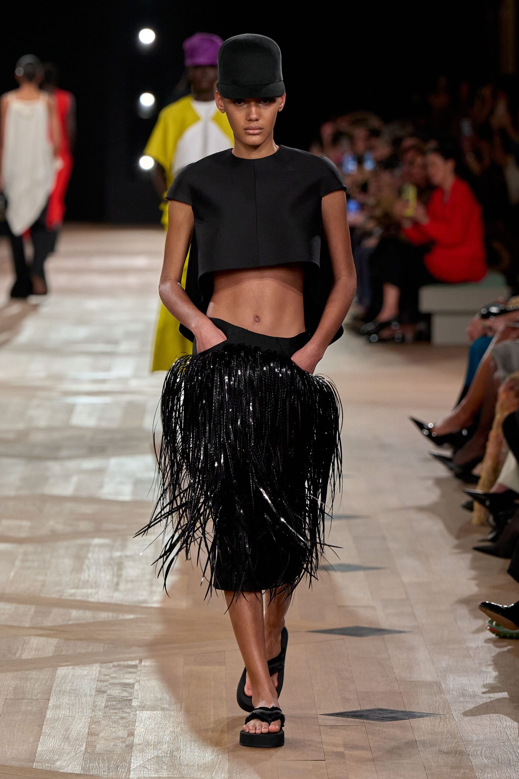 black cropped top with fringed skirt