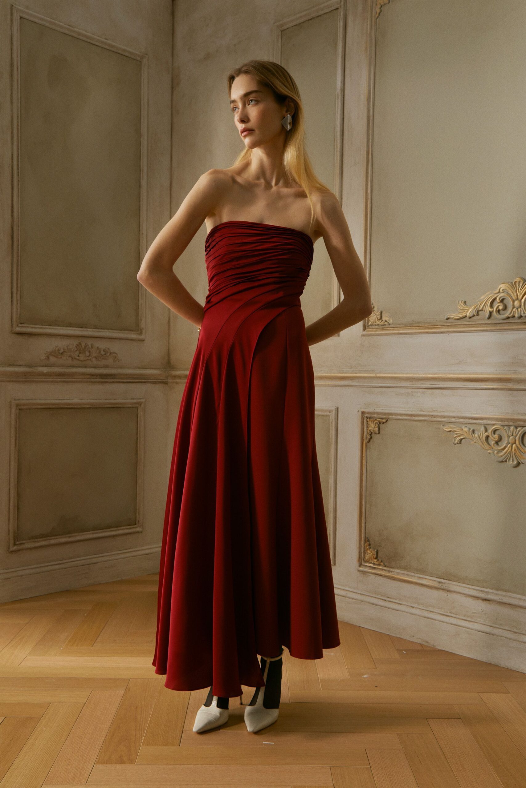 red silk strapless fitted ruched flowing maxi gown