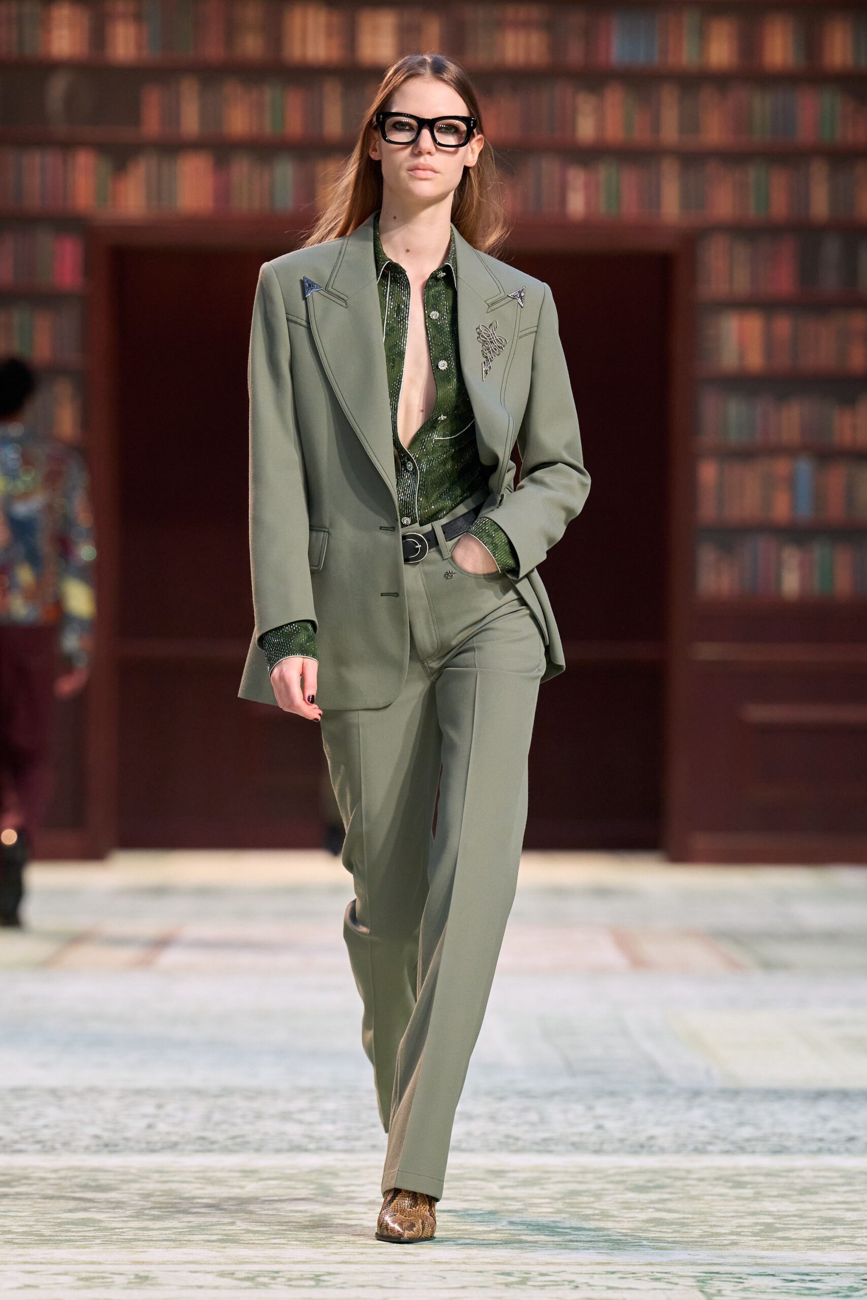 green tailored suit with embellished shoes