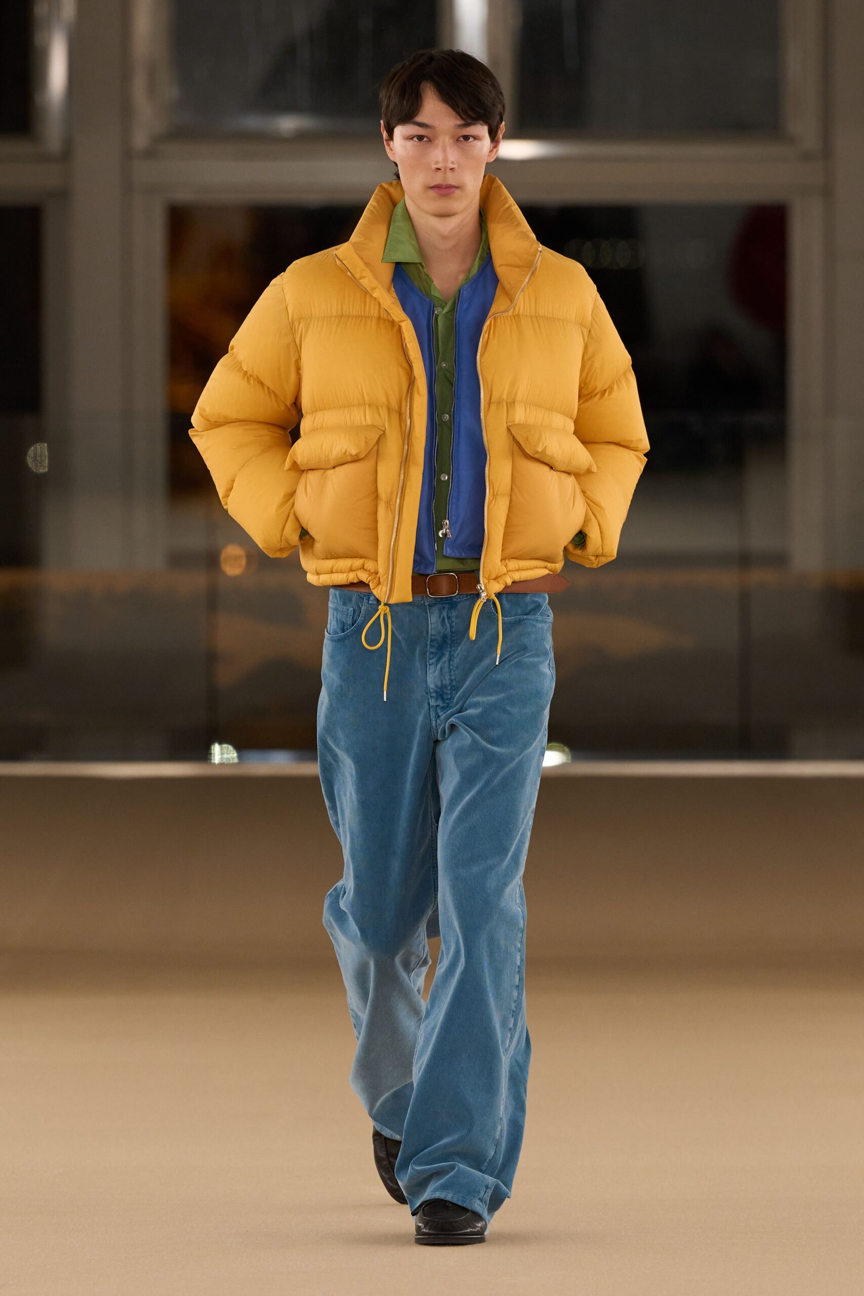 yellow puffer jacket blue shirt