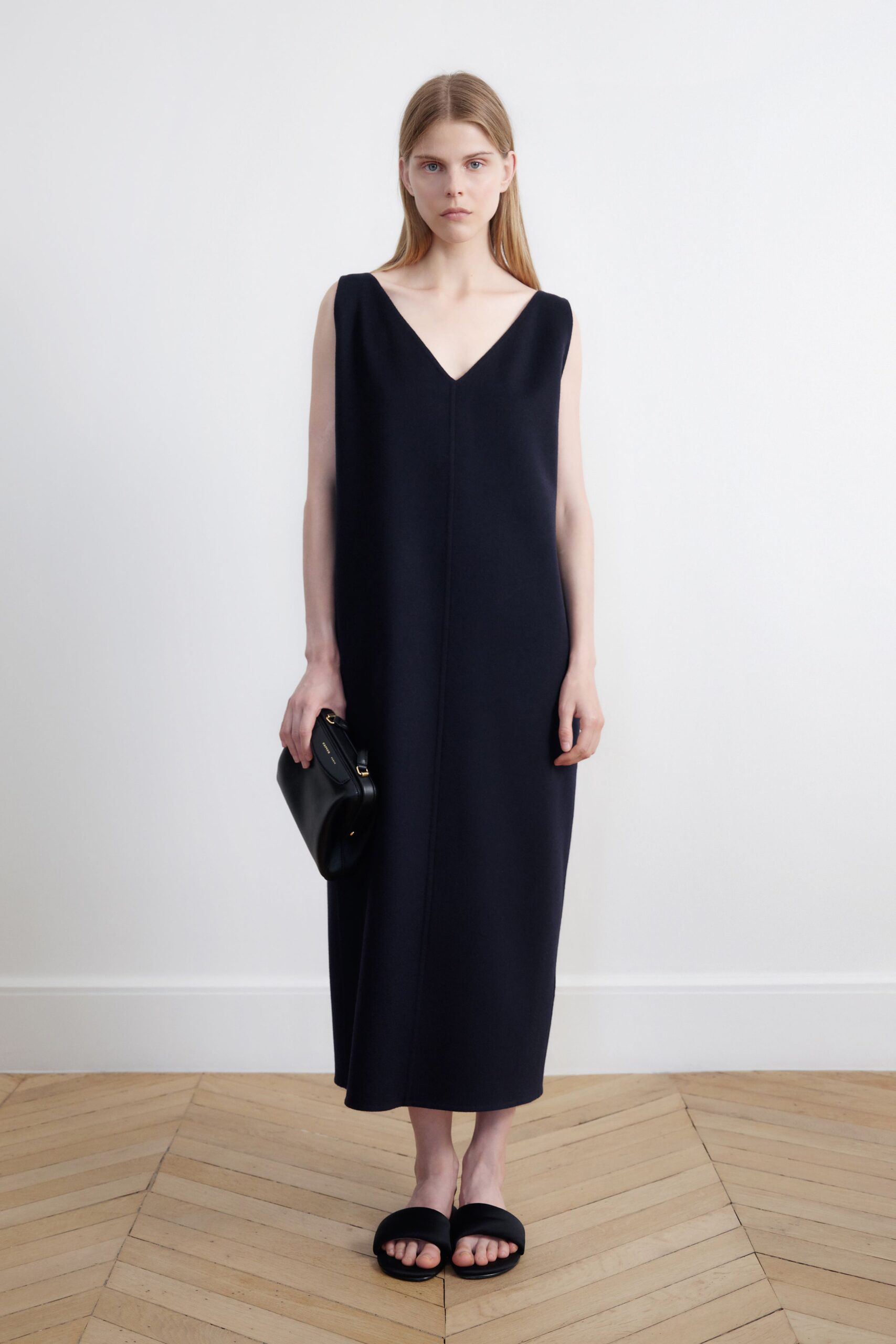 black fitted sleeveless midi dress